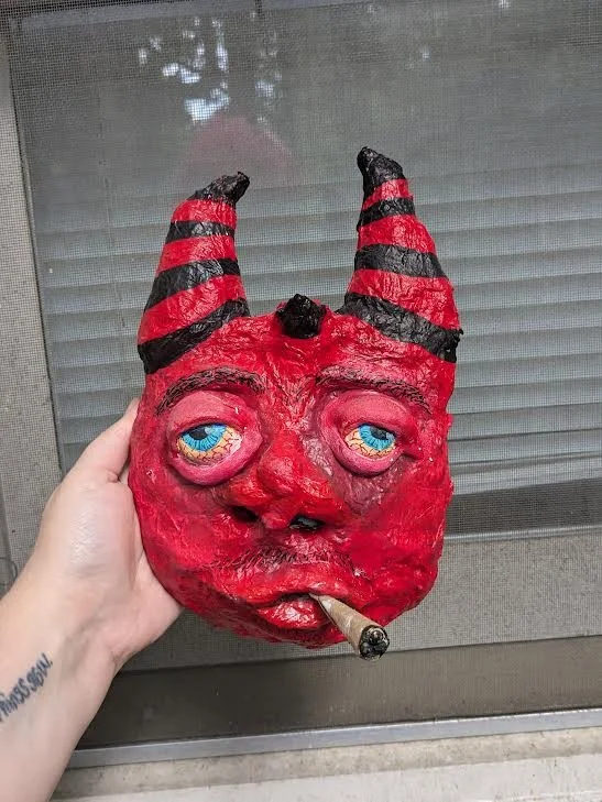 "Devil Boy" by Jordan Little; papermache, cardboard, wire, acrylic paint; 2024