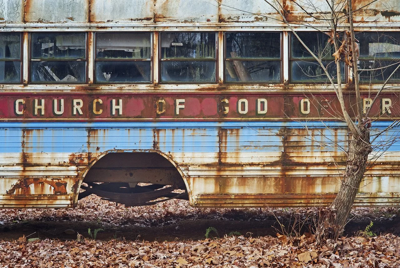 "Junked Church Bus" By Eric Saunders, Photography; 12 x 18 image, 18 x 24 frame;
taken 2011, edited 2025