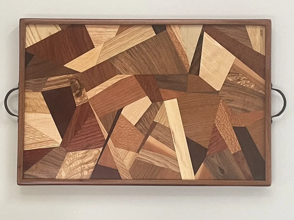 "Tray/Wall Art #2" by Cris Eklund; exotic wood veneers and solid walnut banding; 2023