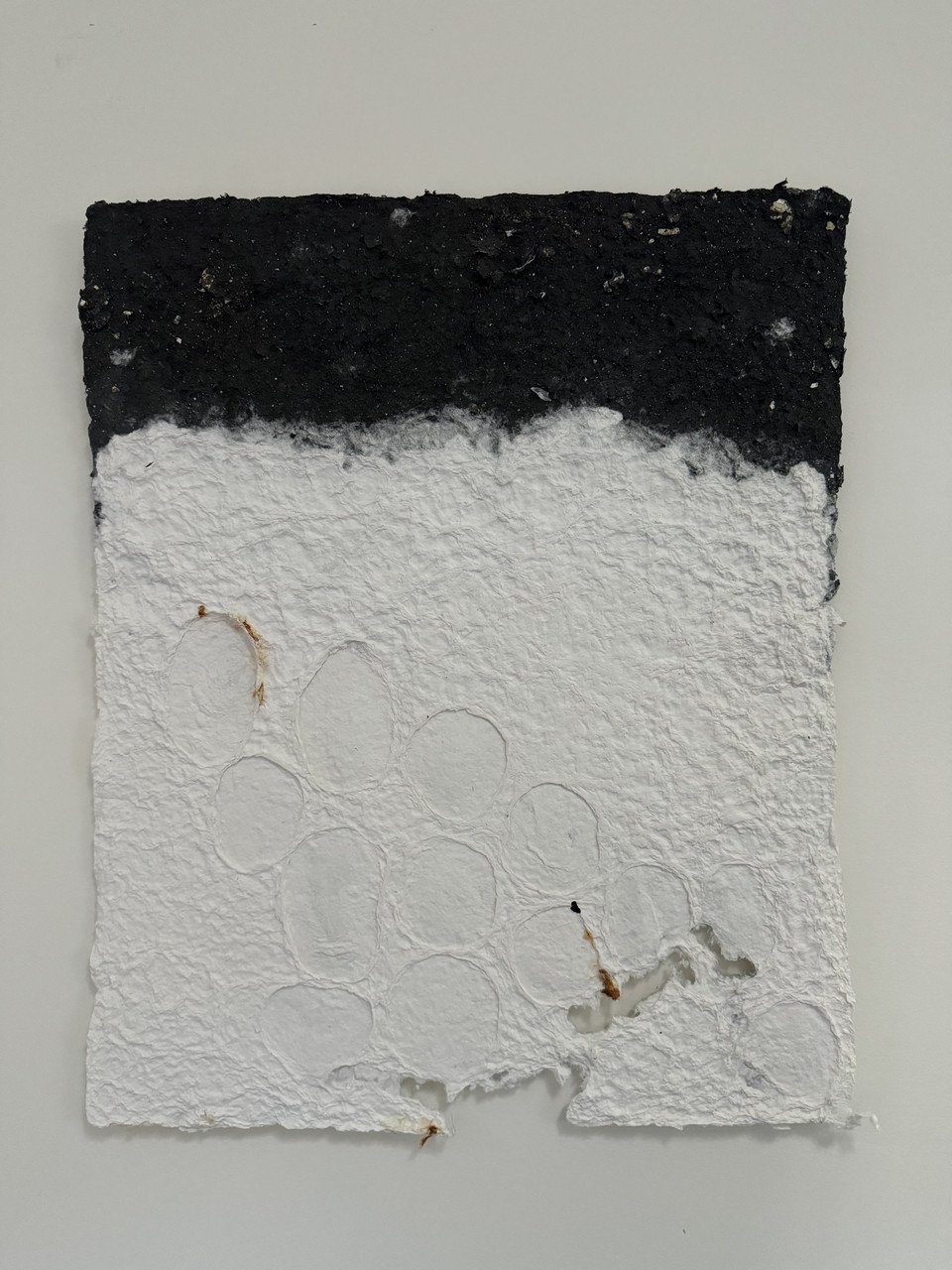 "AGGRESSION IN PROPORTION TO DECLINE" by Donna Hall; handmade paper; cotton, wood ash, sand, eggshells; 2024
