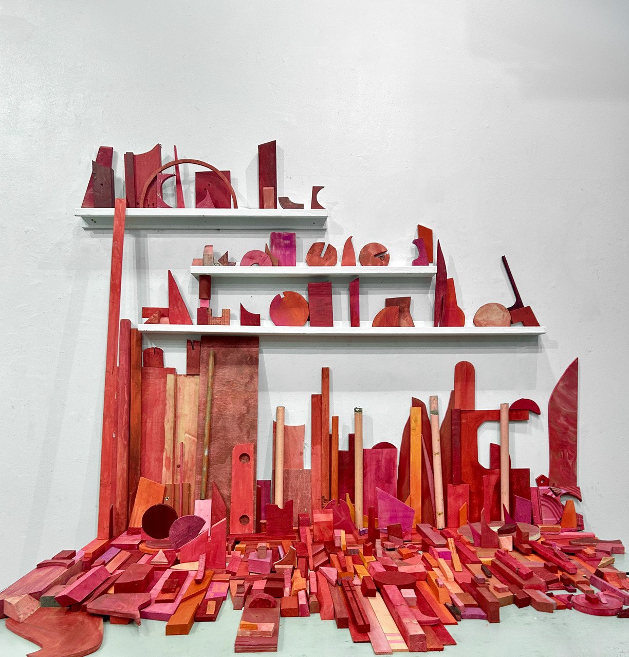 "Shape Shop" by Jason Lord; discarded wood scraps and acrylic; 2024