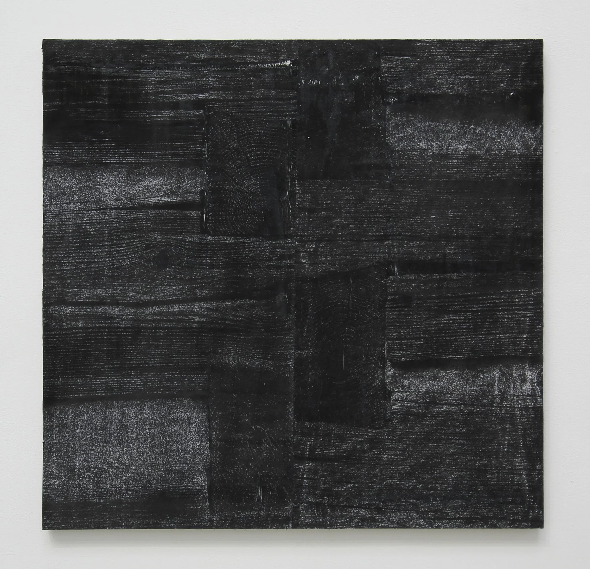 Traces of Displacement IV_2025_White charcoal rubbing, laser-cut engraving, and paper_23 x 23 ½ inches.jpg