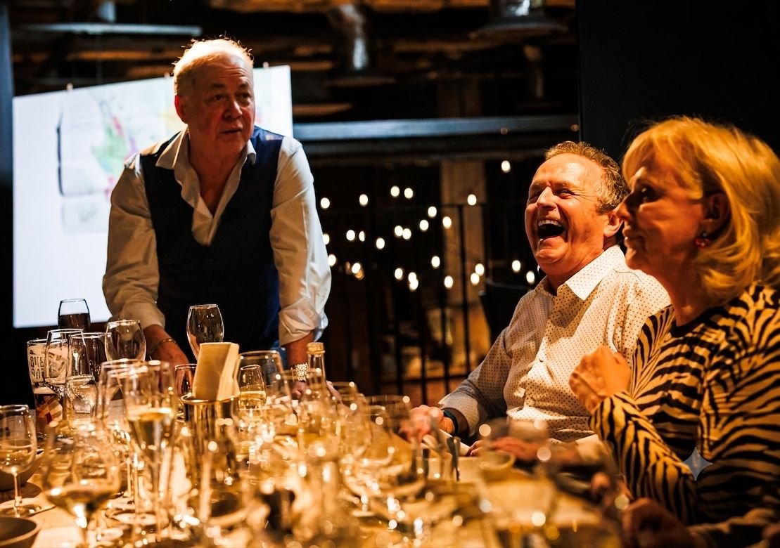 Guests sharing a laugh during an interactive private wine tasting experience hosted by Colby Wines in Liverpool.