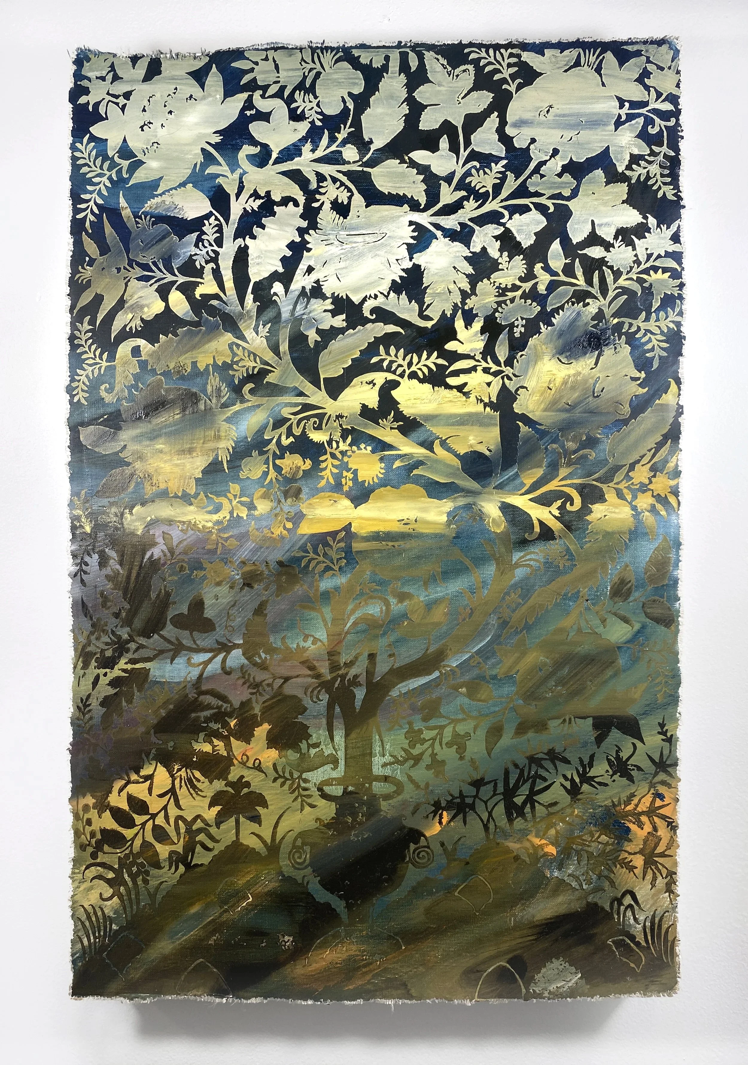 A decorative cutout pattern on a reflective surface, showing a natural scene with trees, birds, and a sunset or sunrise sky.