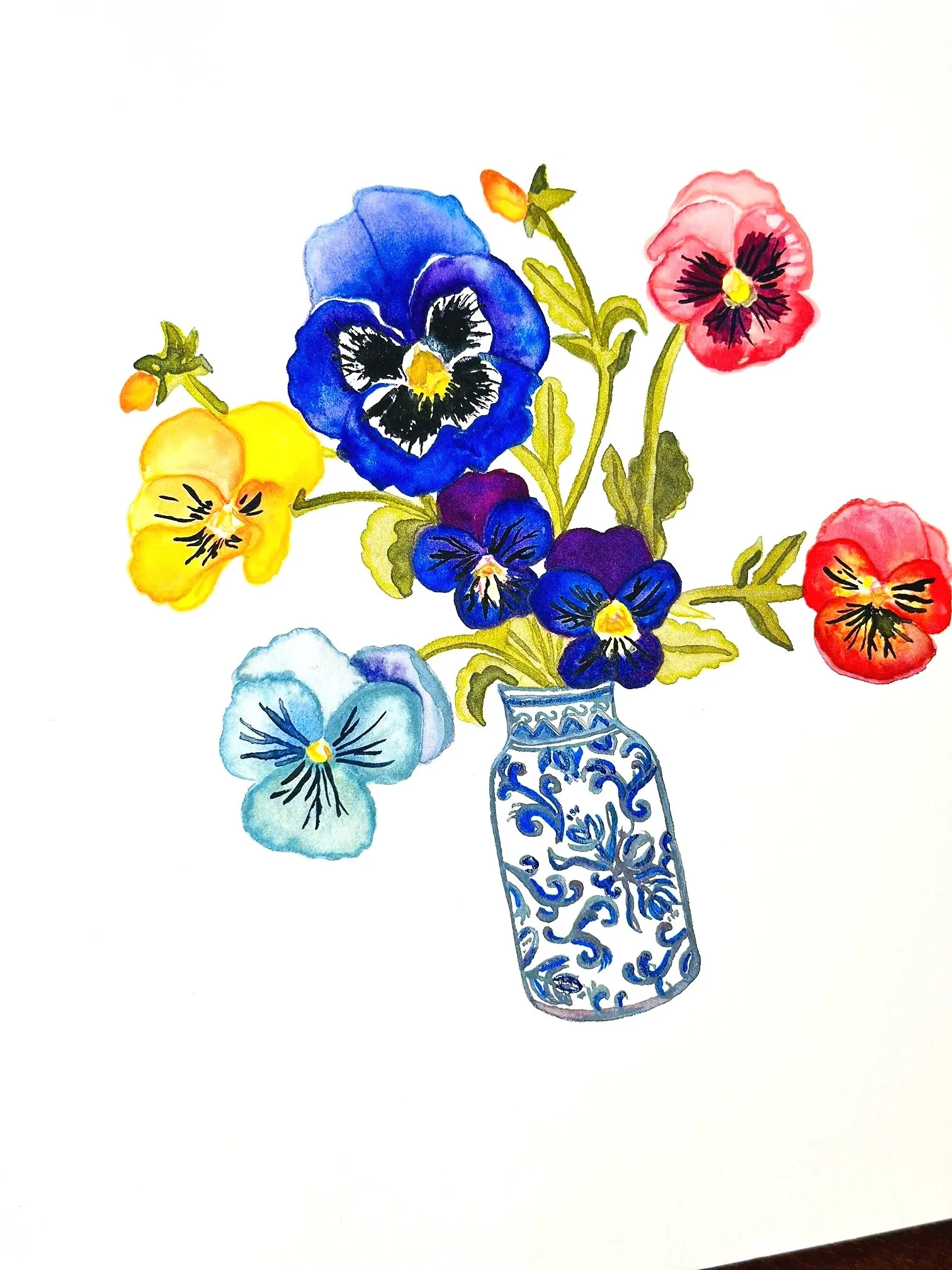 Watercolor painting of multi-colored pansy flowers in a decorative blue and white vase.