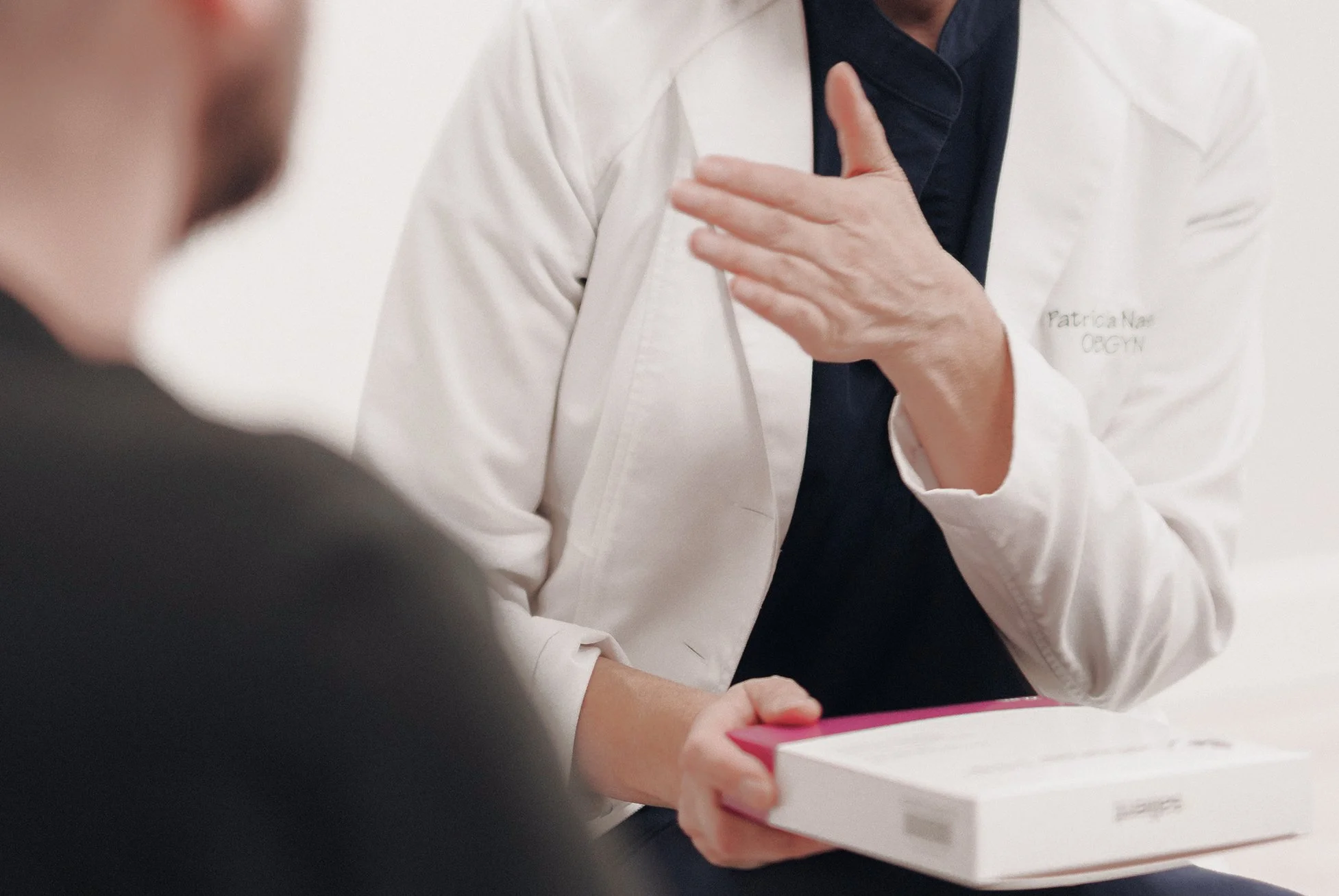 Dr. Patricia Nascu consulting with a patient at Acantha Clinic, showcasing compassionate women’s health and medical aesthetics care.