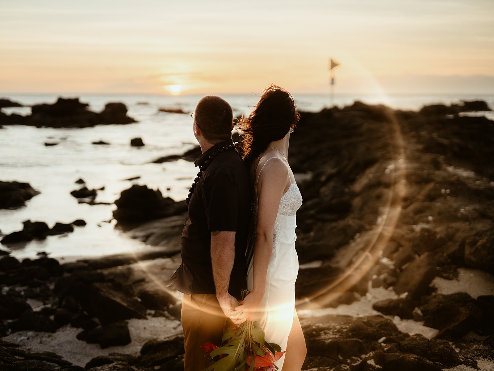 Elopement Photographer capturing couple at the sunset time in Kukio Beach
