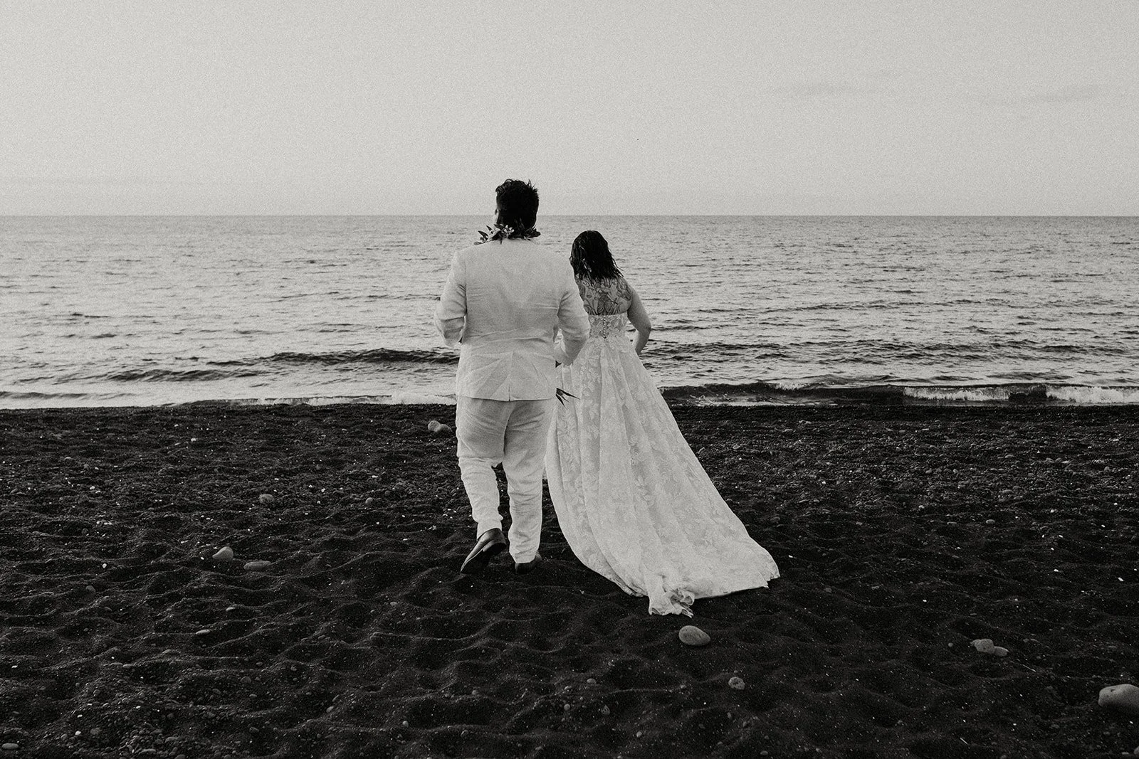 Hawaii elopement ceremony on black sand beach by Couple Cups Photography