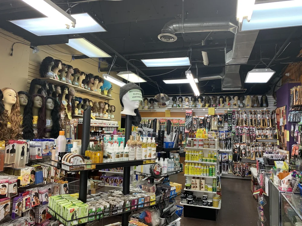  Beauty supply products are on display at the entrance of Ragga Hair Studio &amp; Beauty Supply Store on Friday, March 19, 2021. (DeAndra Asapokhai/RSJ) 