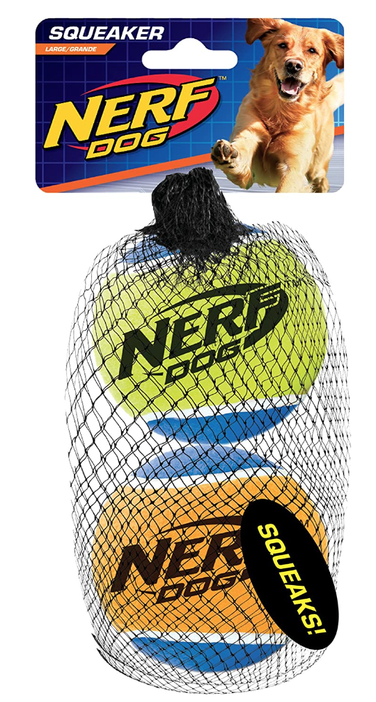 A pack of large Nerf Dog squeaky tennis balls in a mesh bag with a cardboard label. The label has an image of a happy golden retriever dog and the Nerf Dog logo.