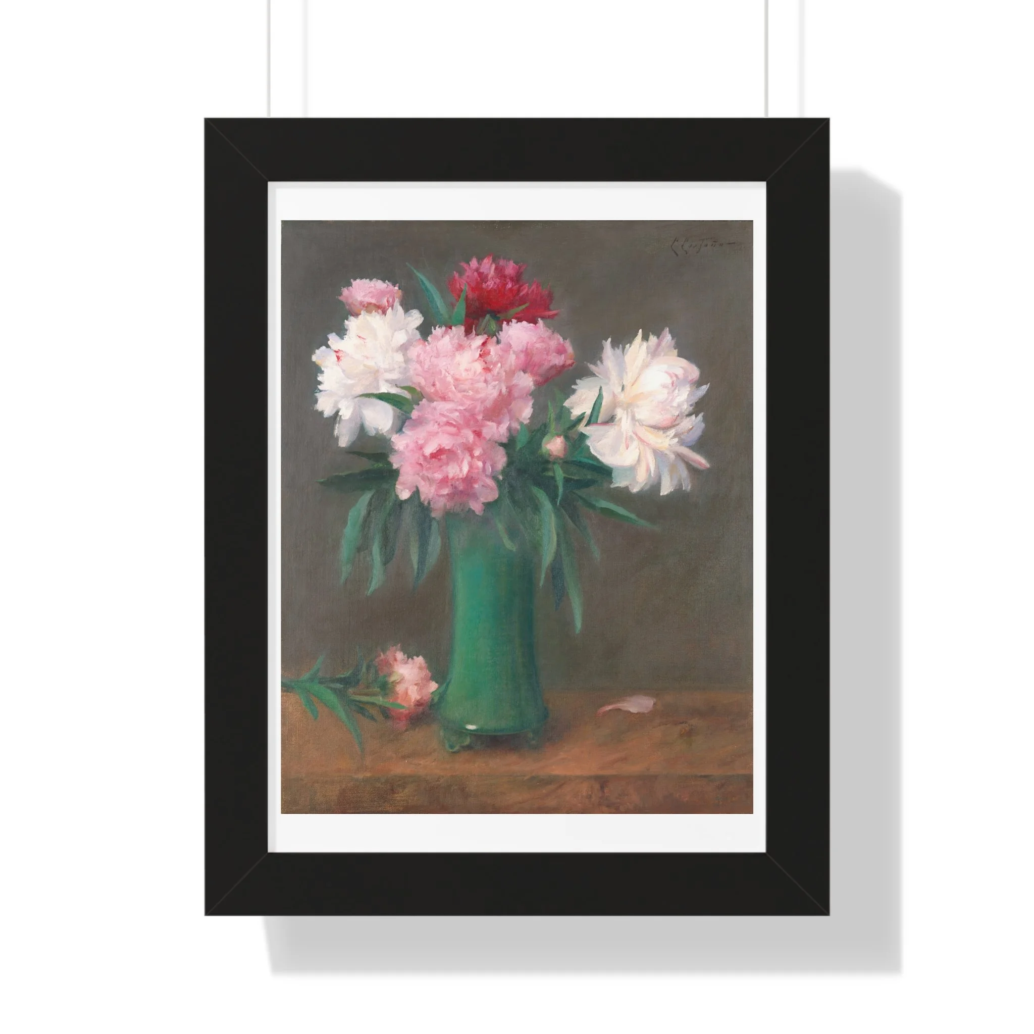 Fine art print of pink and white peonies in a green vase with soft lighting and muted background in black frame