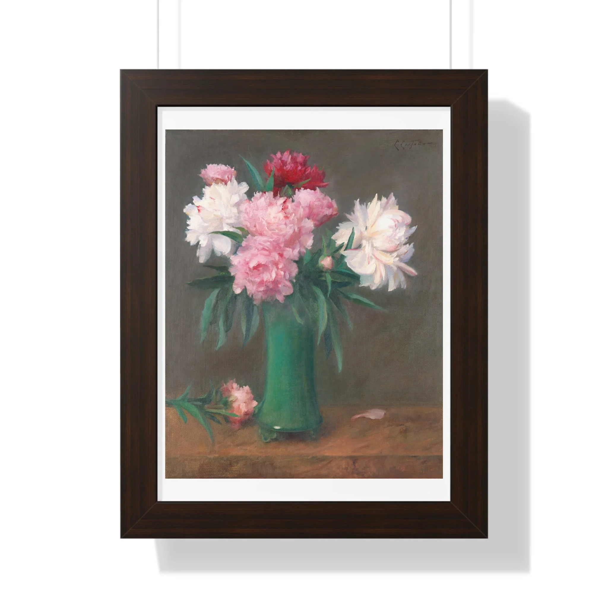Fine art print of pink and white peonies in a green vase with soft lighting and muted background in walnut frame