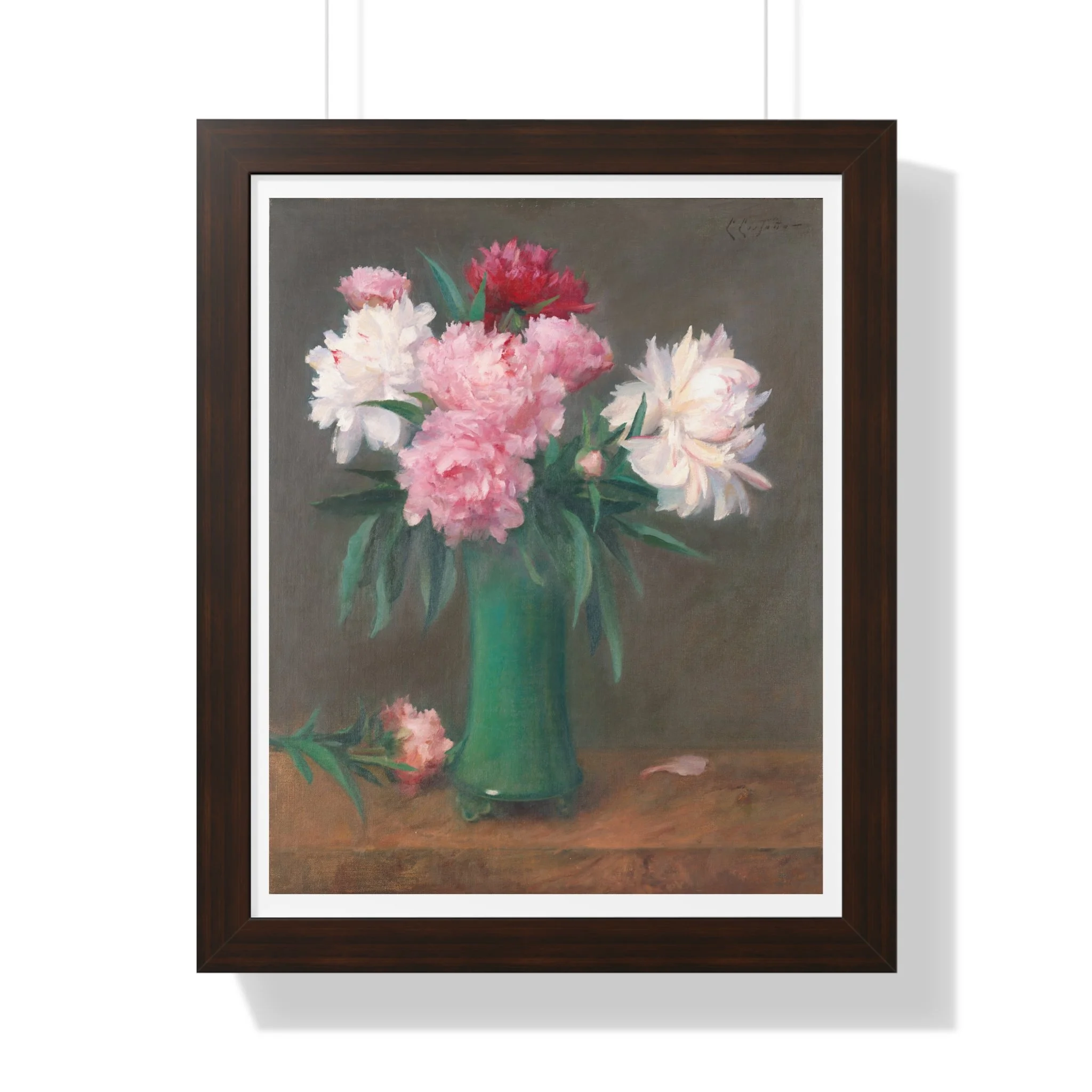 Fine art print of pink and white peonies in a green vase with soft lighting and muted background in walnut frame