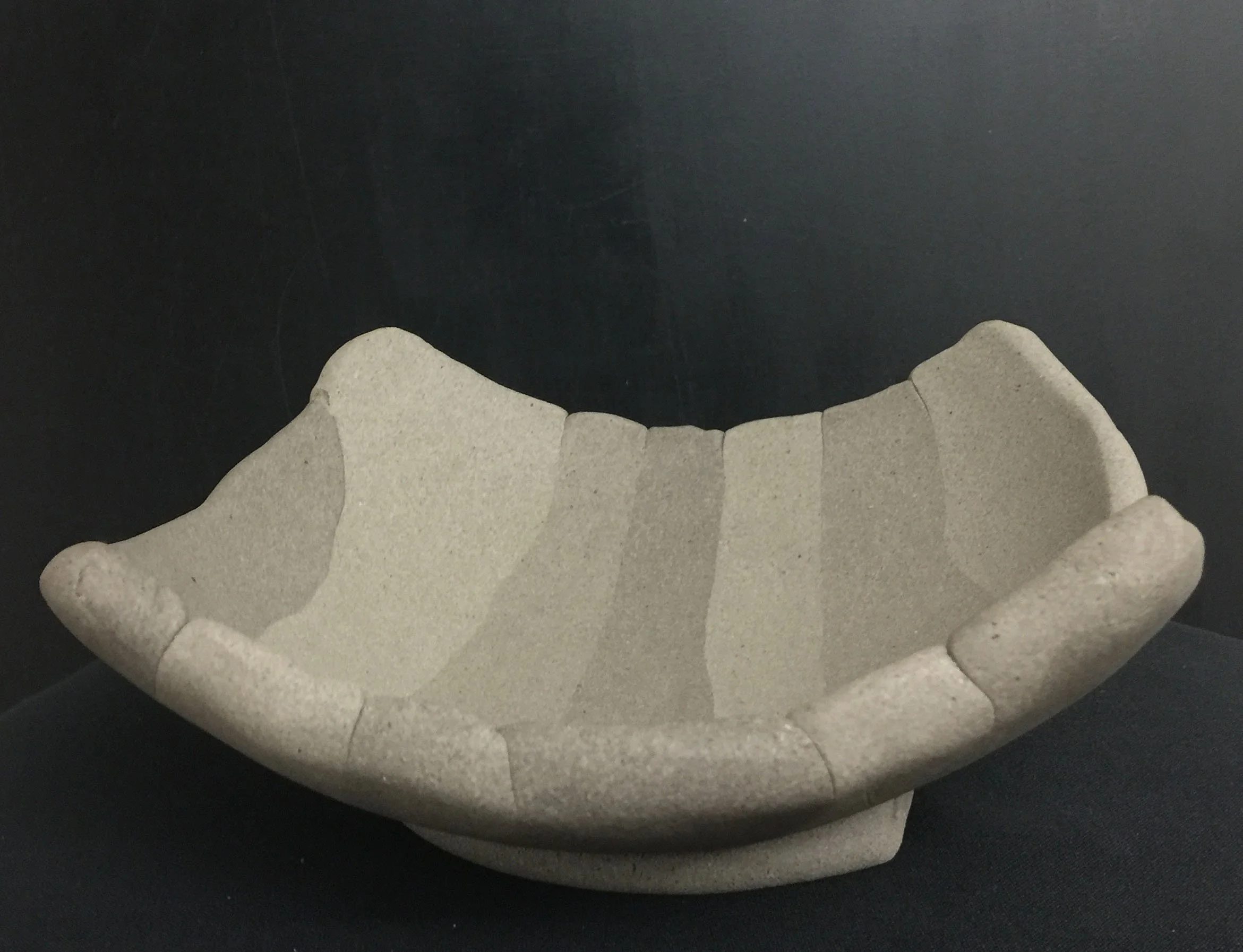 Unglazed yakishime stoneware bowl with sculptural minimalist form