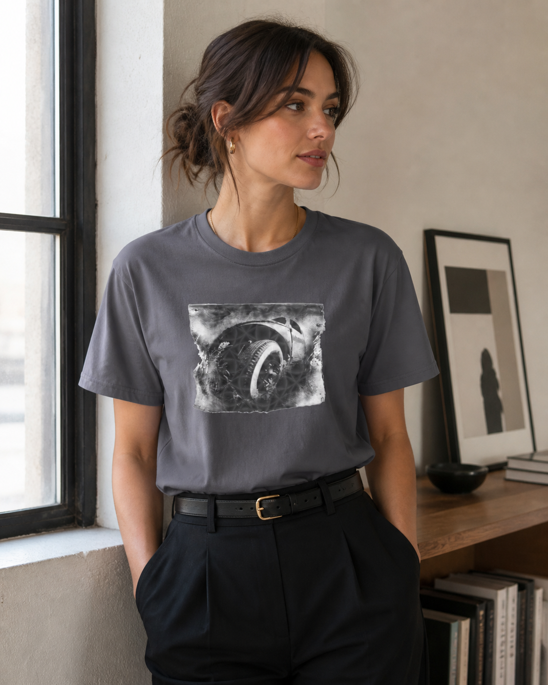 Female model wearing black and white industrial wheel photography graphic printed on grey t-shirt