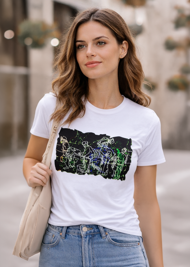 White t-shirt featuring a black and green graphic of a band playing instruments. The design is a line drawing style. The model is wearing blue jeans.