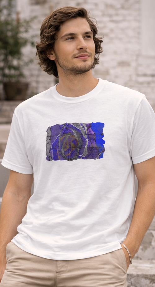 male model wearing white t-shirt of vivid shades of purple, blue, gold, and charcoal abstract art