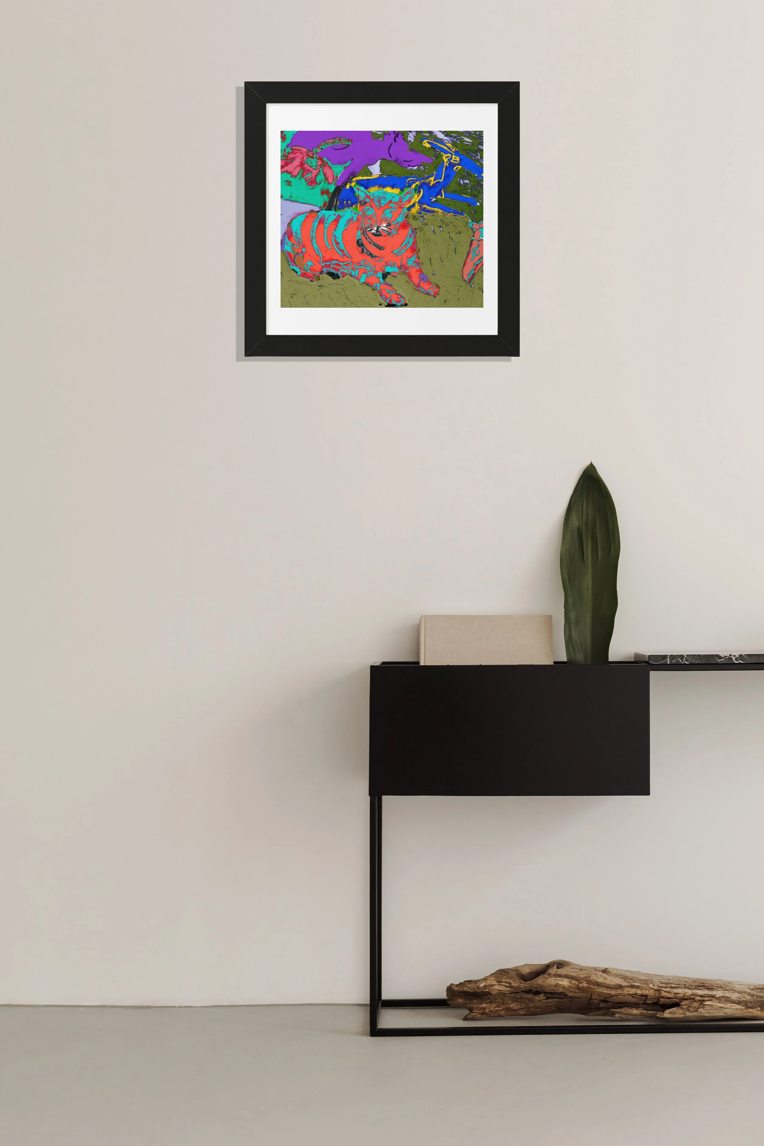 A framed art print featuring a colorful abstract illustration of a cat. The cat is depicted in shades of red and orange with striped patterns. The background includes purple, green, and blue hues.