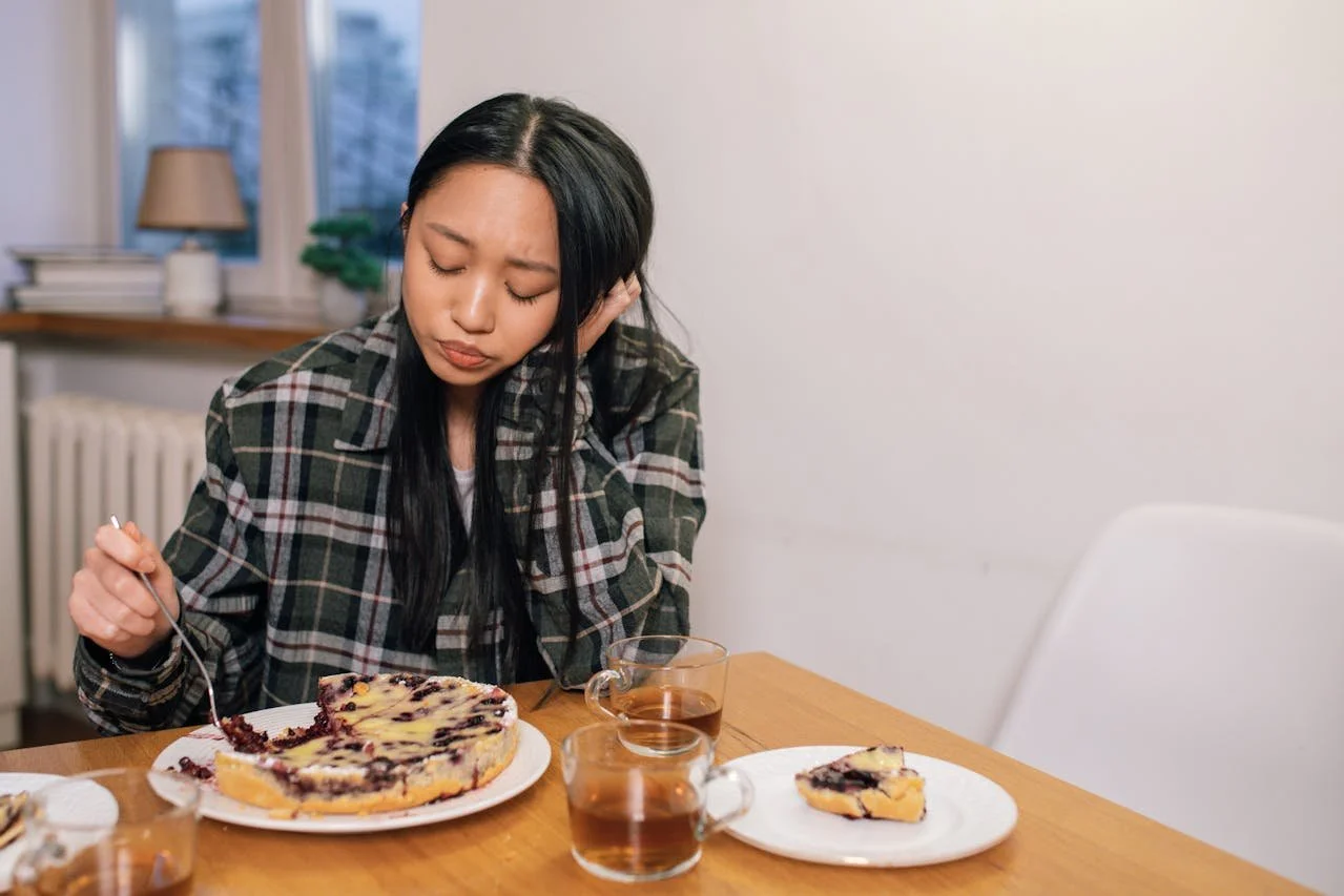 sad-woman-in-black-plaid-long-sleeves