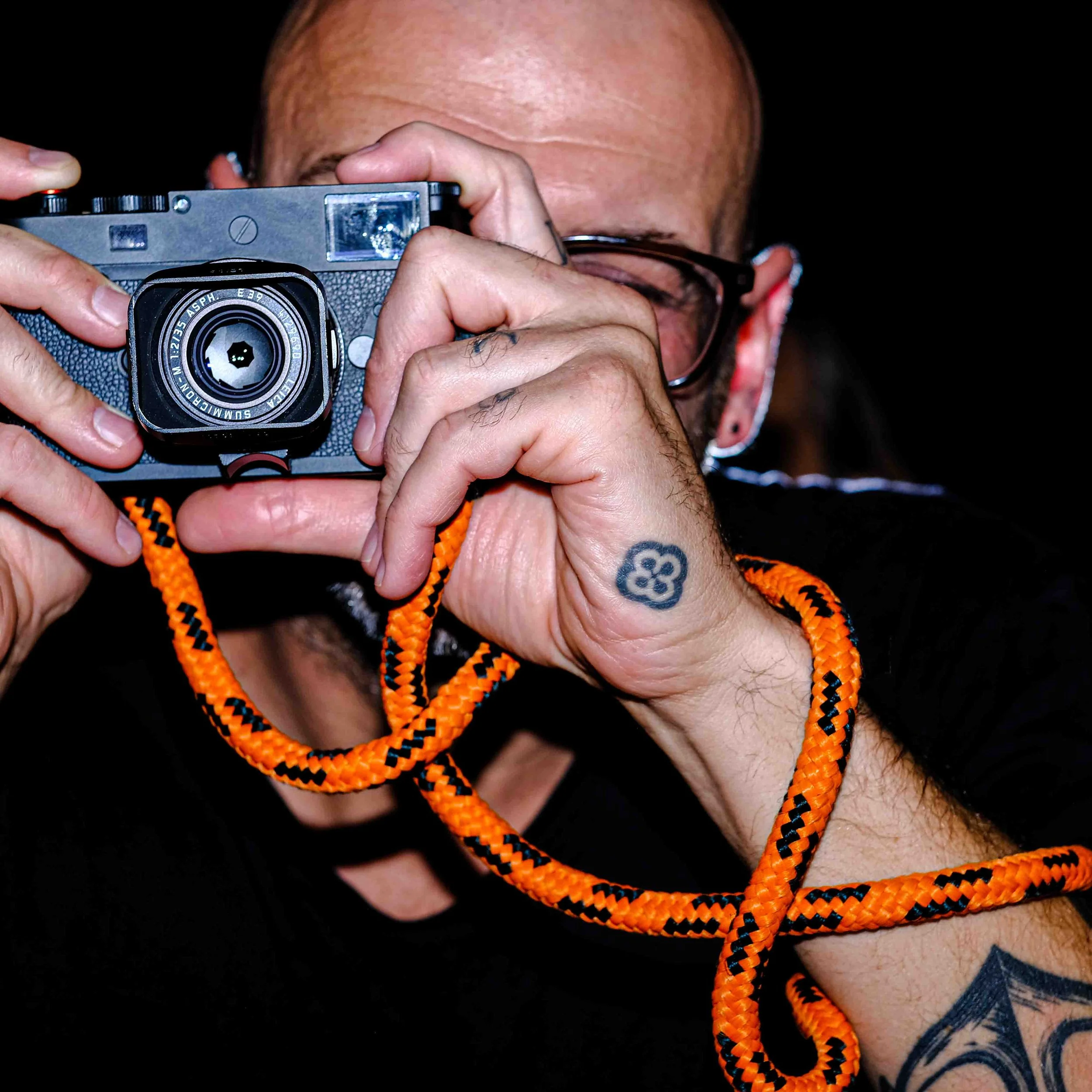 Michał Marchocki. Shooting a Leica m monochrom camera with an orage rope camera strap from Sailor Strap.