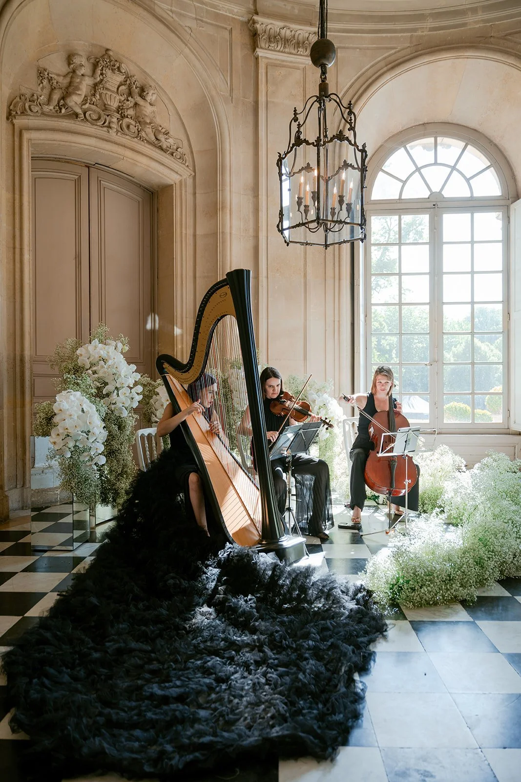 Harpist and musician welcoming guests 2.jpg