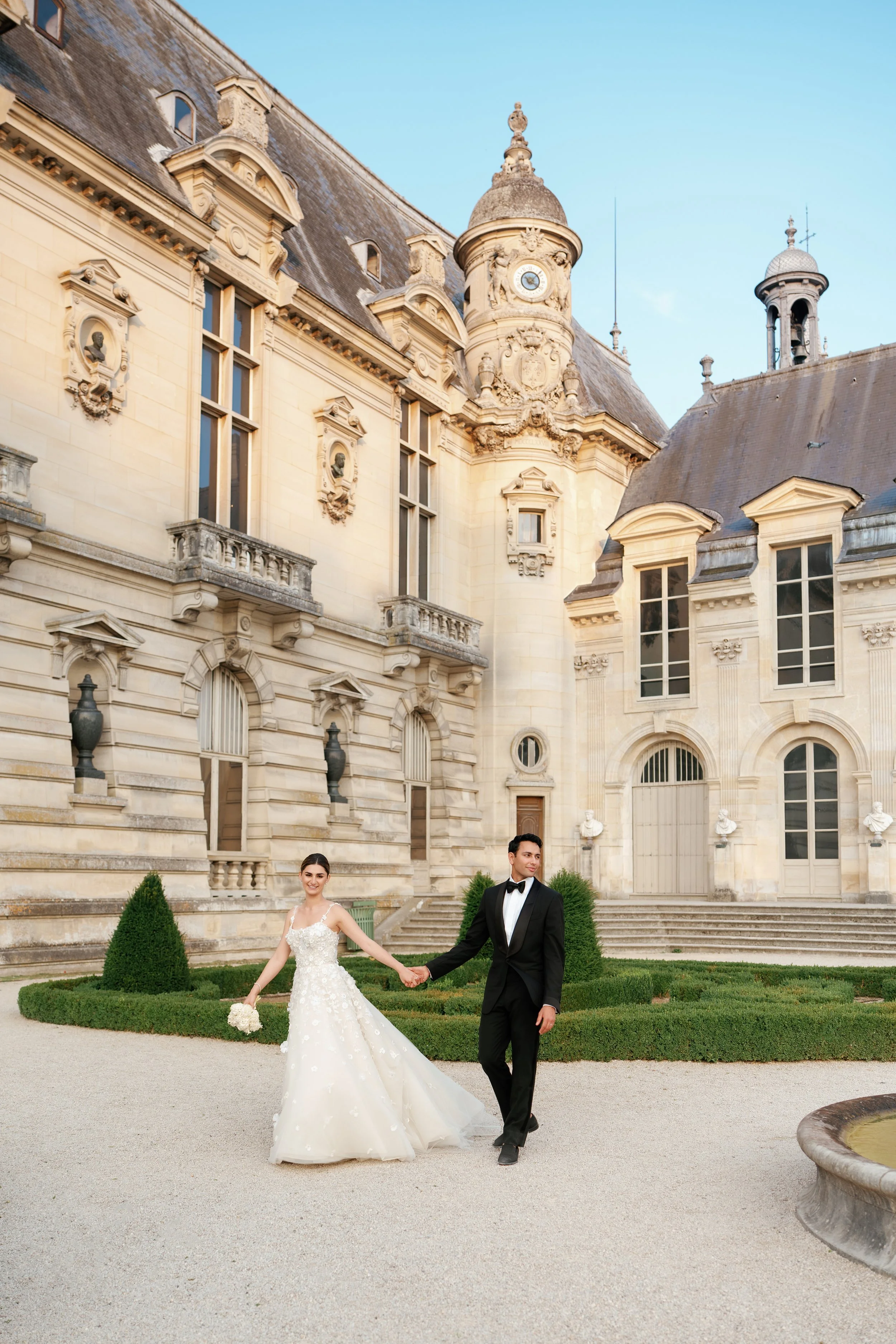 Chateau-Chantilly-Bride and Groom in front of a castle 2.jpg