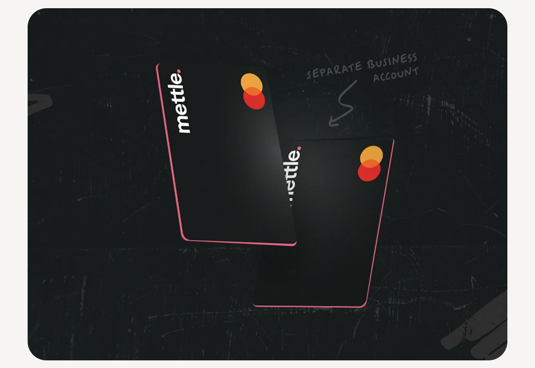two black mettle credit cards on a black background