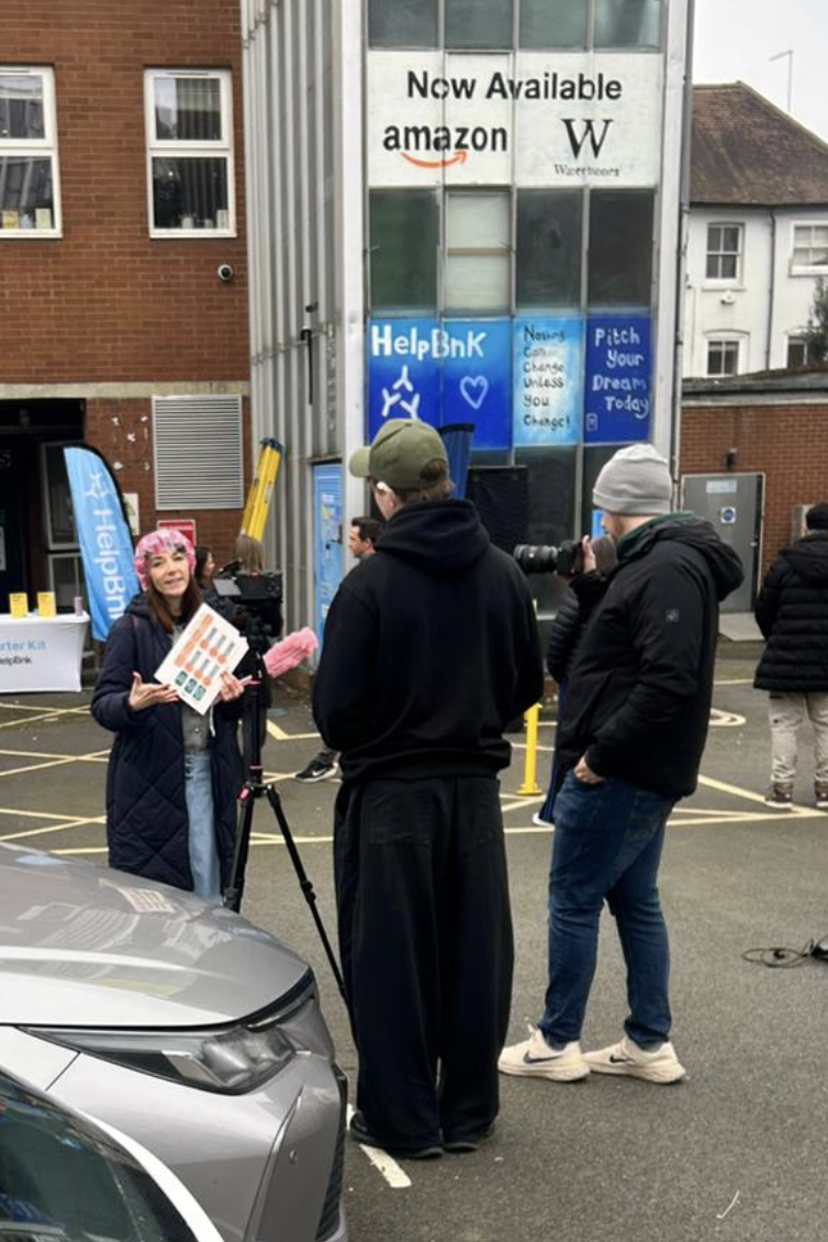 Kim talking to cameras in her showercap
