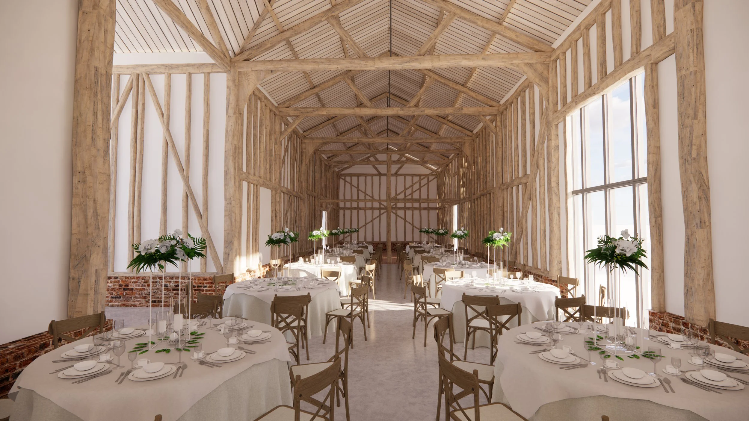 Exposed oak timber frame of the main venue barn laid out for a wedding breakfast at Braham Hall Barns, Suffolk