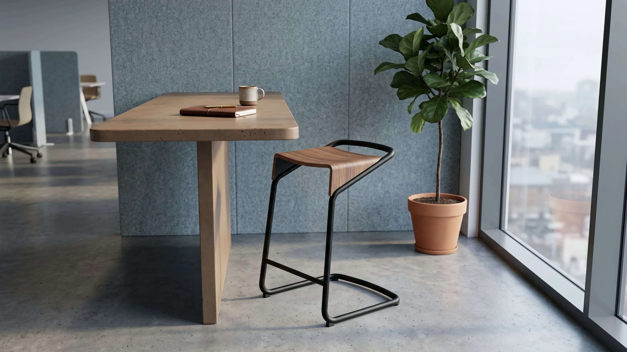 A Camber stool with a black frame and Walnut seat in a quiet corner of an office.