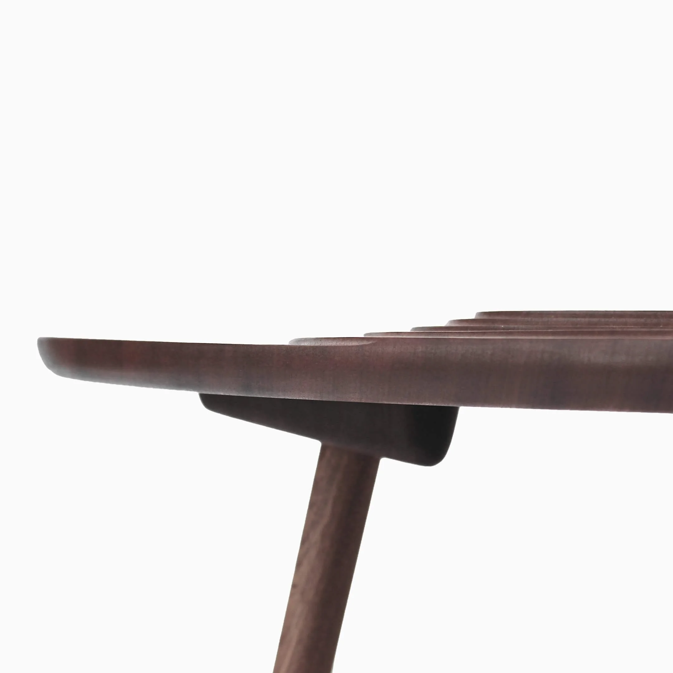 Side view of the Terrace coffee table. Clearly visible are the terraces sweeping across the tabletop.