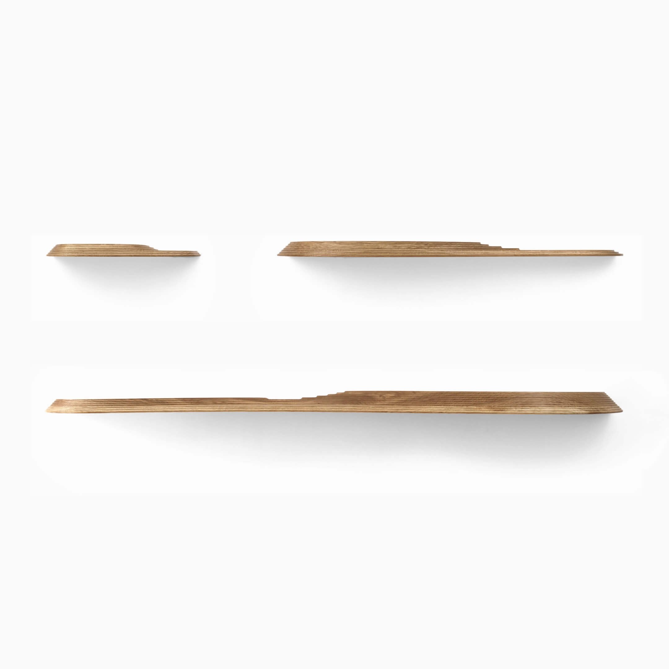 The Terrace wall shelves are available in three sizes, each with a different design. Pictured here are the shelves in solid Oak.