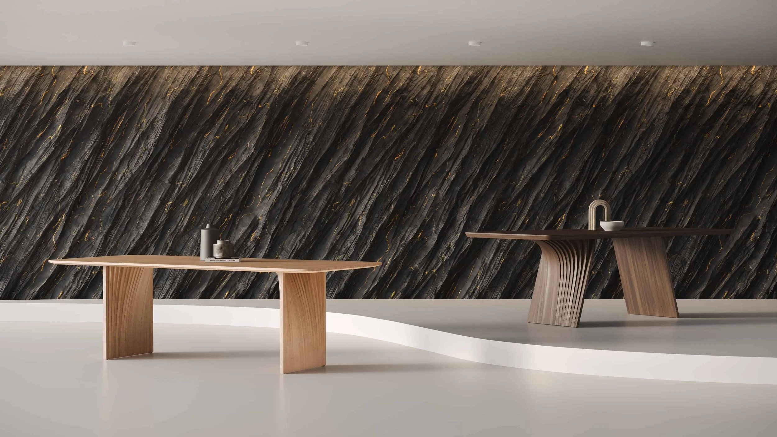 The Sheer and Veer dining tables are part of the same collection of furniture whose designs reference sedimentary rock formations.