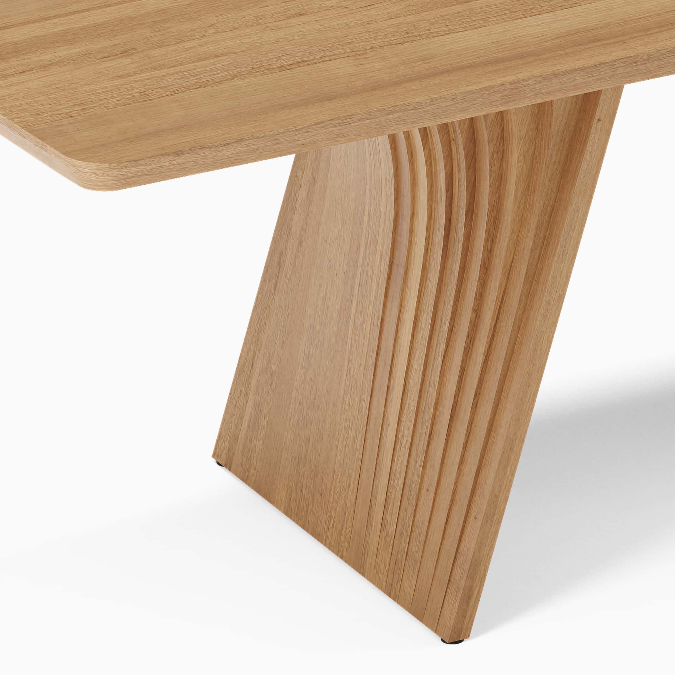 Detail view of the layers of wood constituting the base of a Veer dining table in solid Oak.