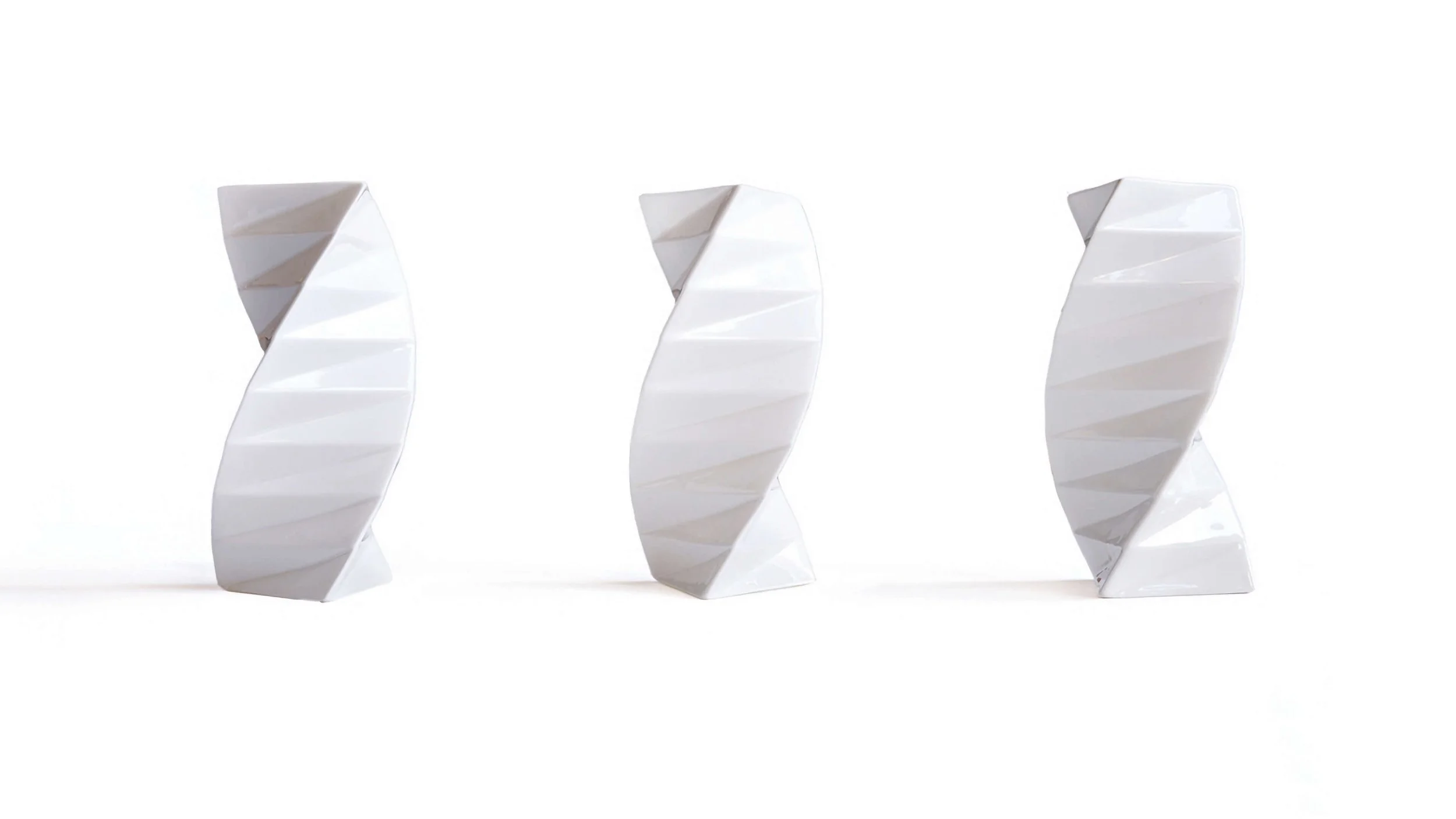 Three Orishe vases, each orientated at a different angle, to demonstrate how its shape appears to change as one's view angle changes.