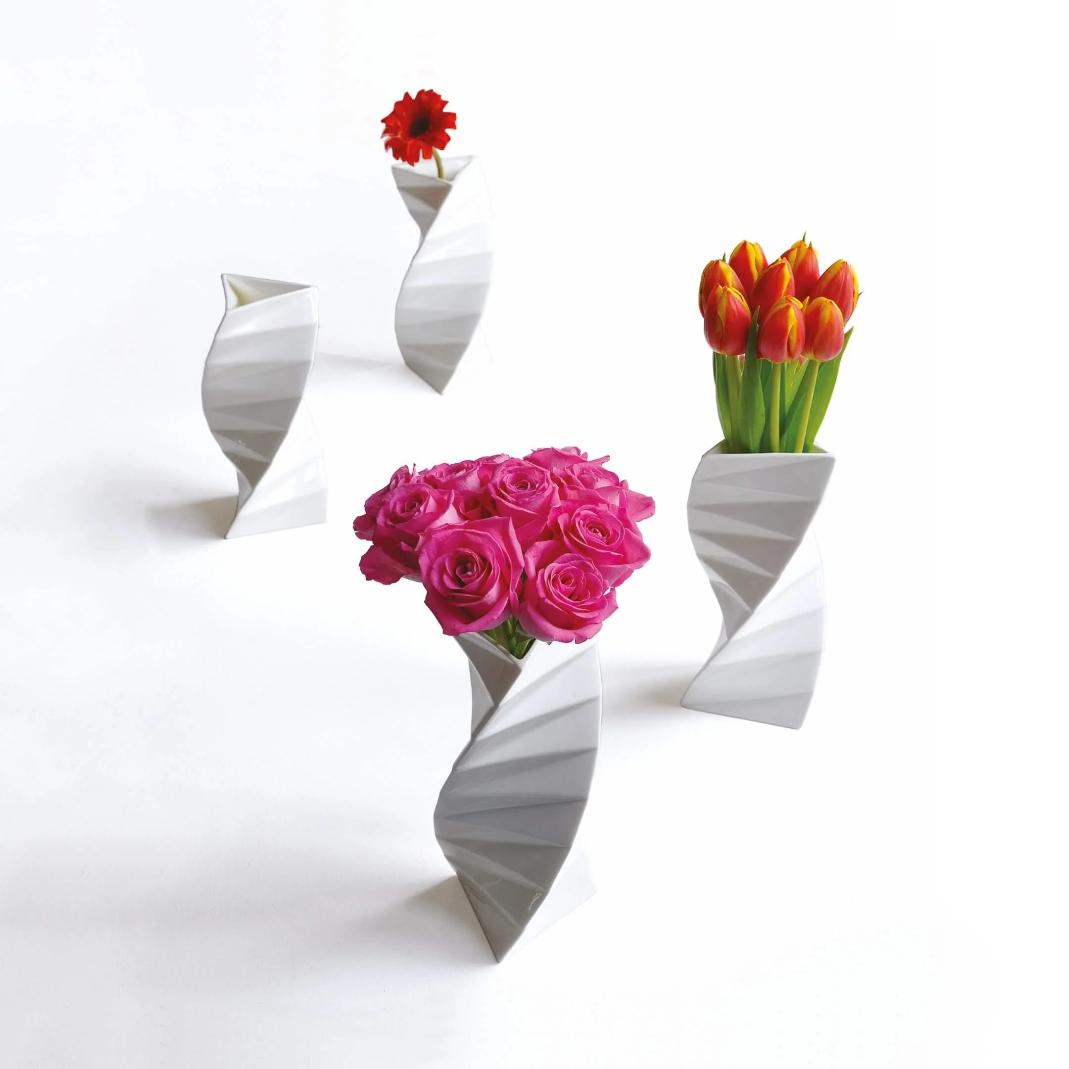 Four Orishe vases, each with different floral arrangements, to demonstrate how Orishe looks beautiful with or without flowers.