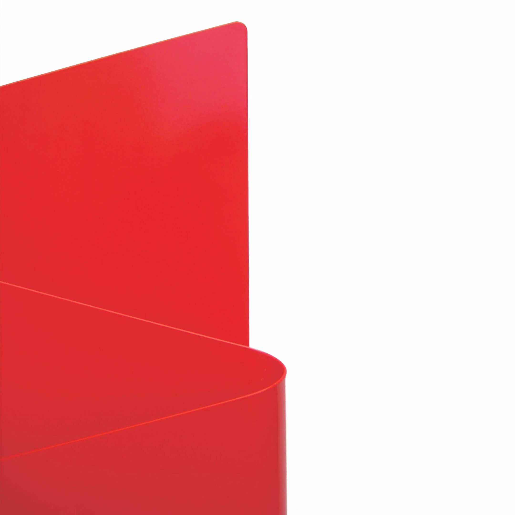 Close up detail of the bent metal form of the Flow magazine rack.