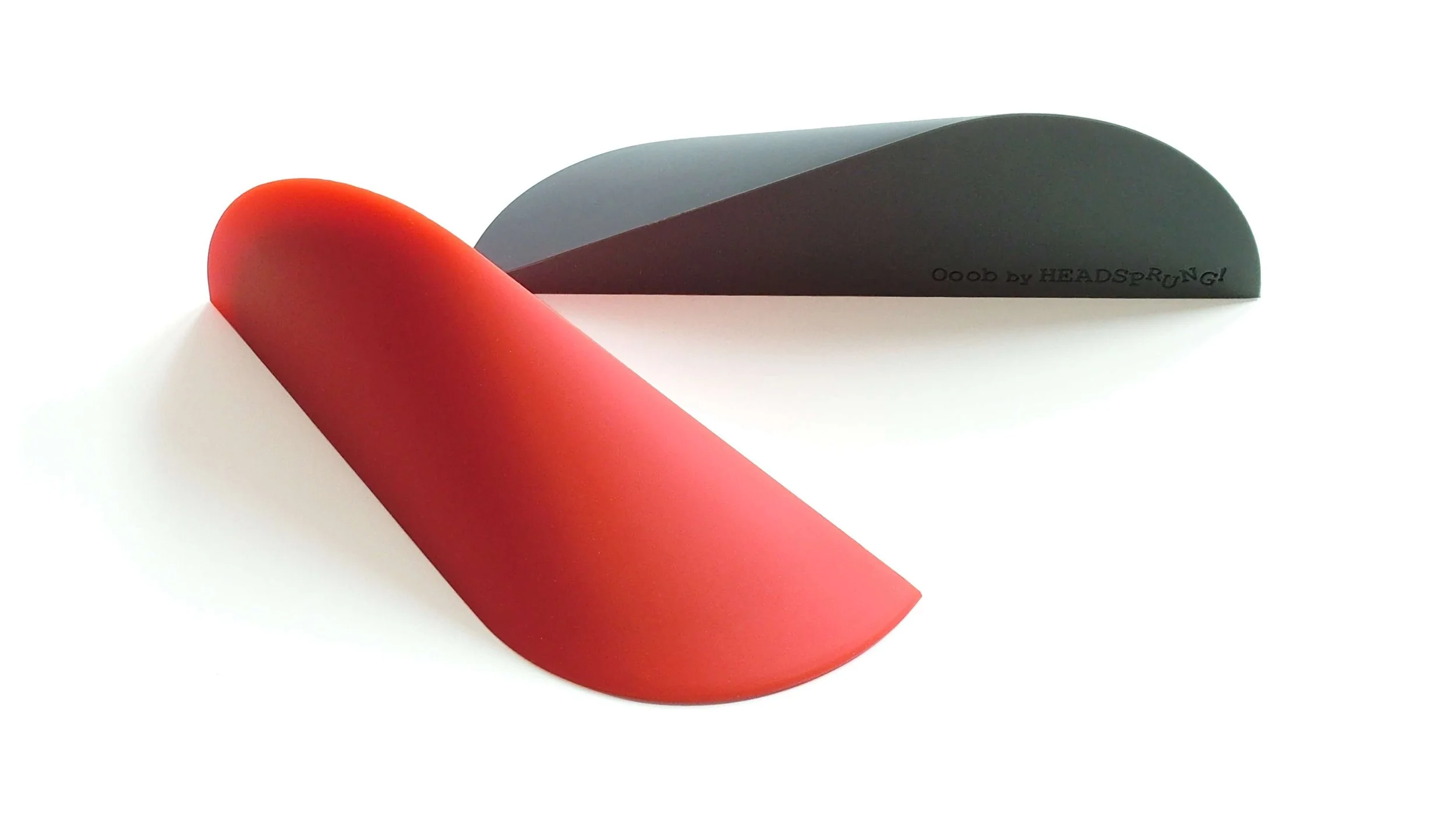 The Ooob Doorstop and Bookend in red and grey.