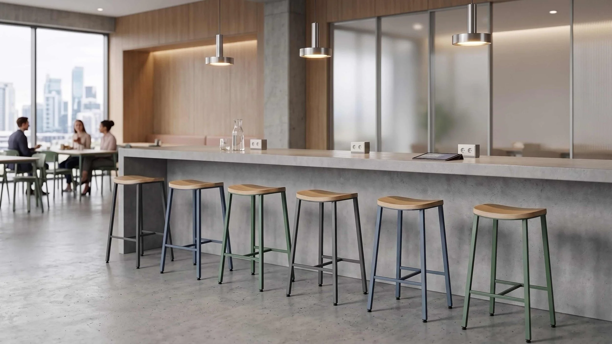 Six Kanso stools line up in front of a counter in a corporate interior.