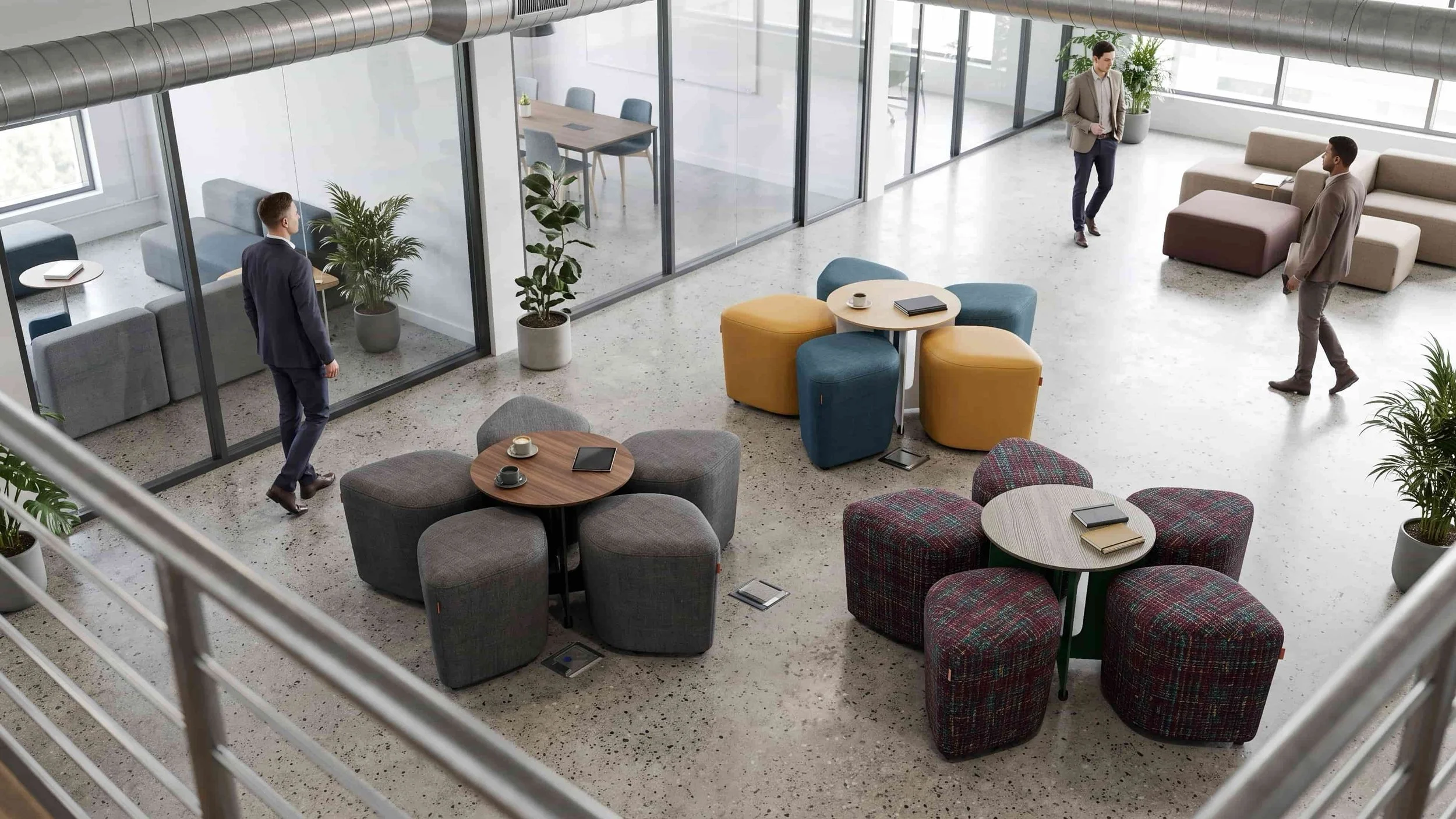 Three Blossom Seating Systems with Tables in a coworking space of an office.