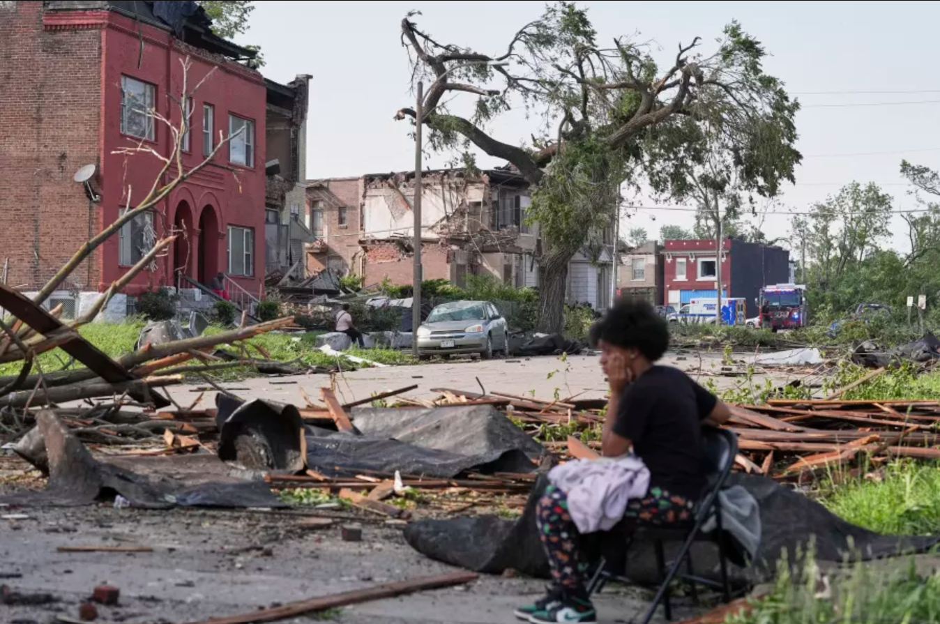 People survey damage after a severe storm moved through Friday, May 16, 2025, in St. Louis.  Jeff Roberson/AP