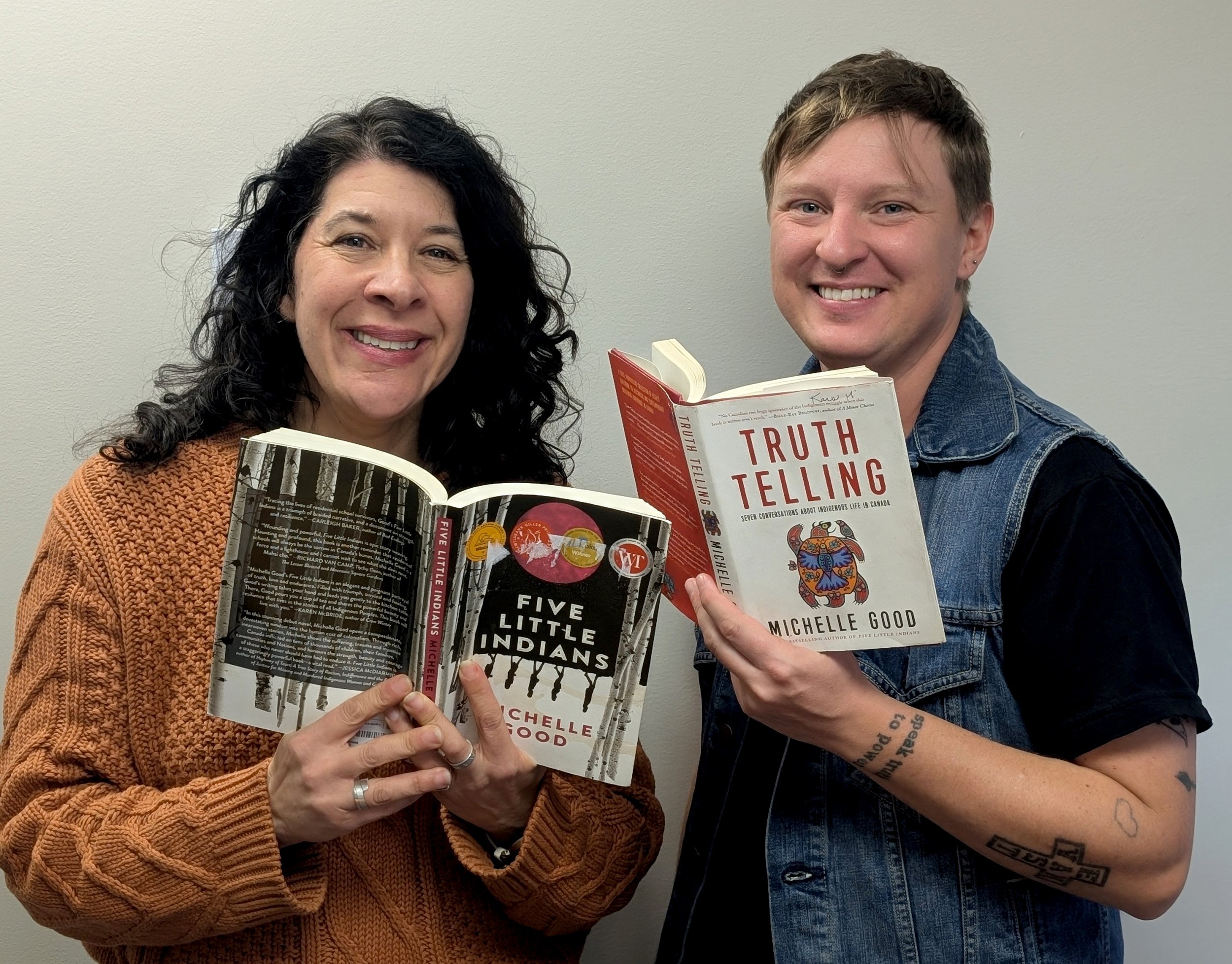 photos of staff members holding Michelle Goods book