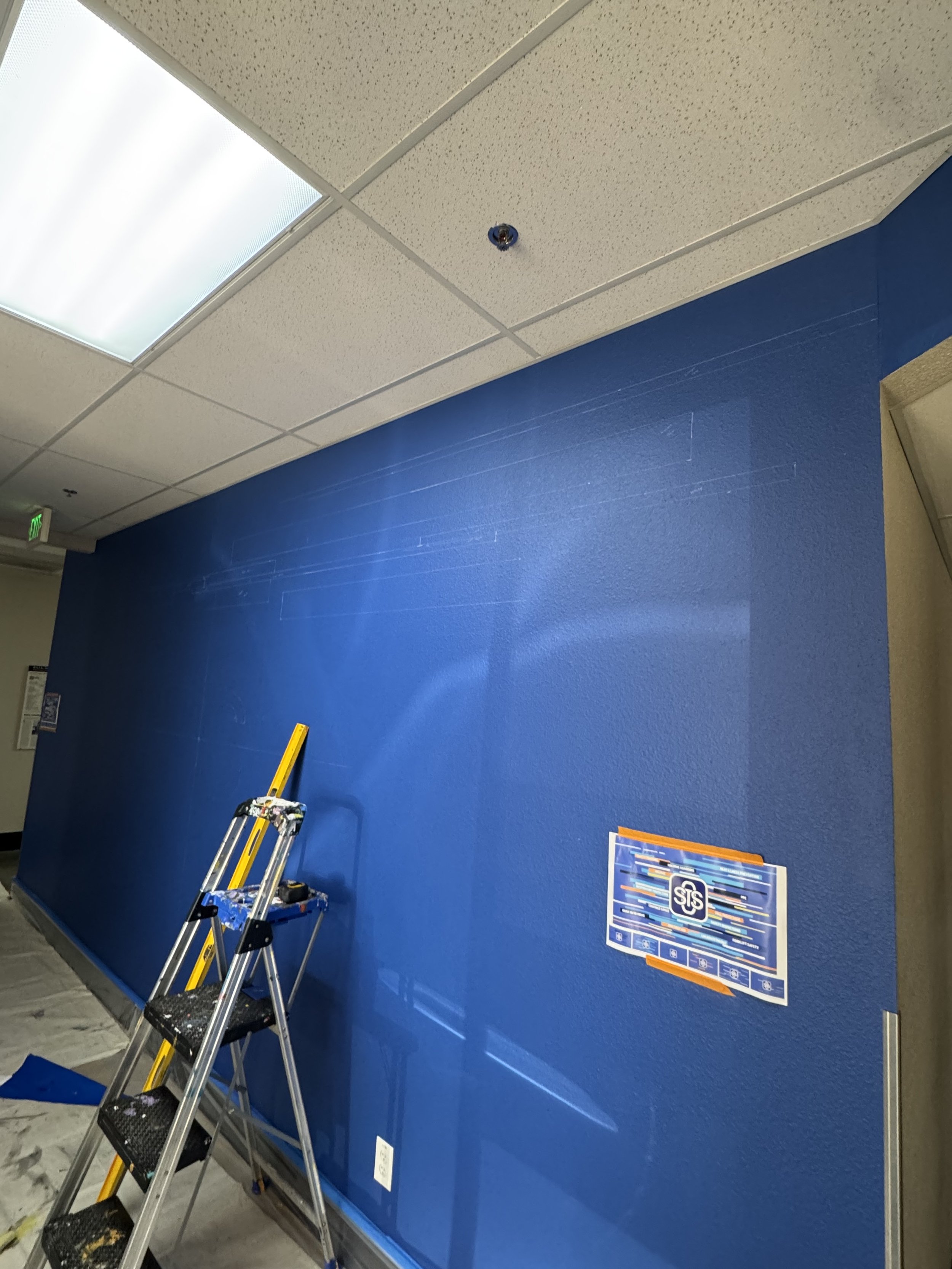 Laying out the mural, this took a day to do with all the colors and layout