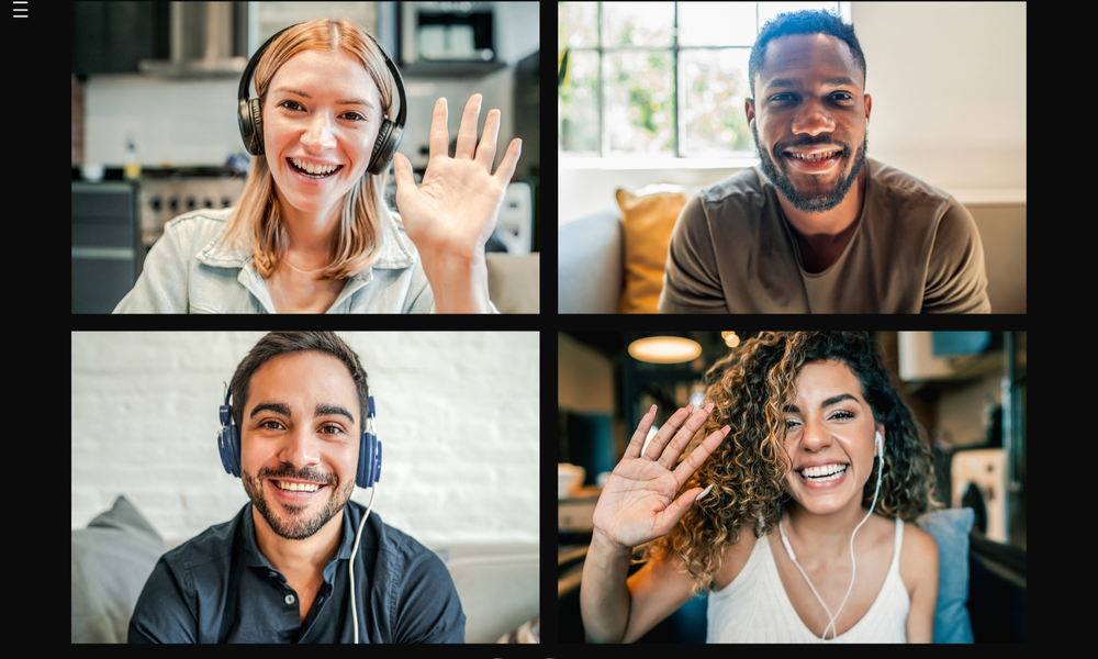 Smiling participants waving on a group video call