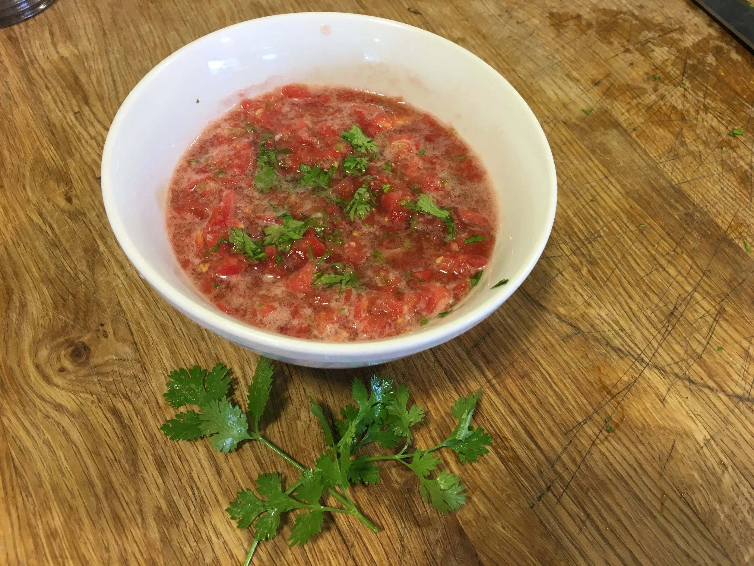 Fresh homemade salsa in a bowl with cilantro