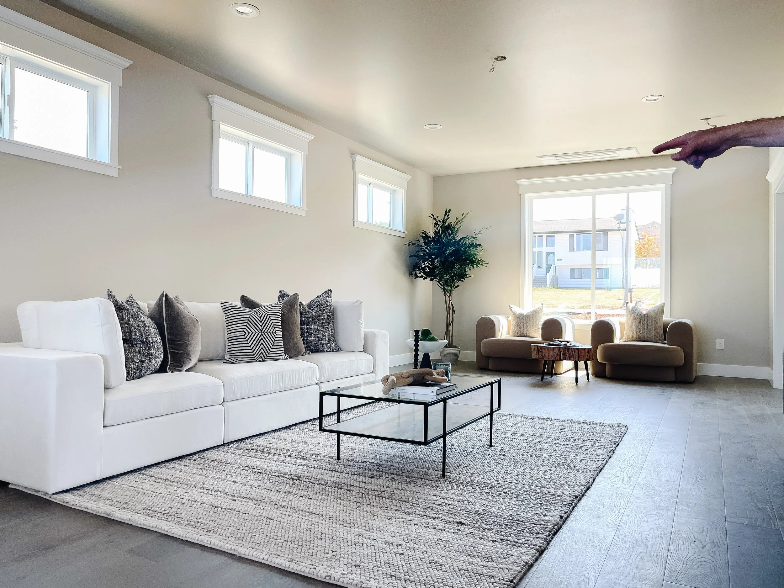 Staged living room in a Friday Harbor home designed to feel warm and inviting for island buyers.