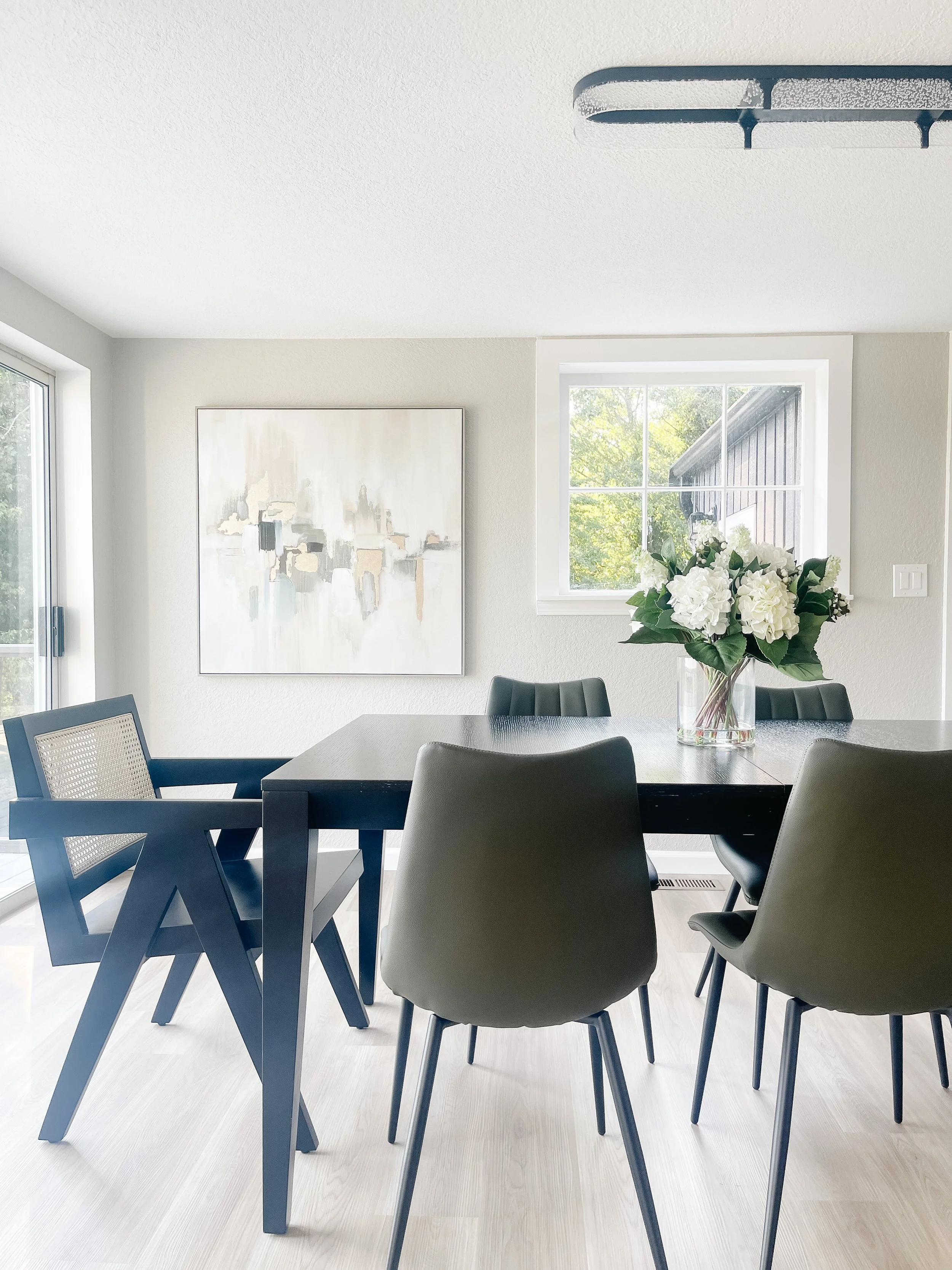 Open-concept living and dining space staged in a Bellingham home to show function and comfort.