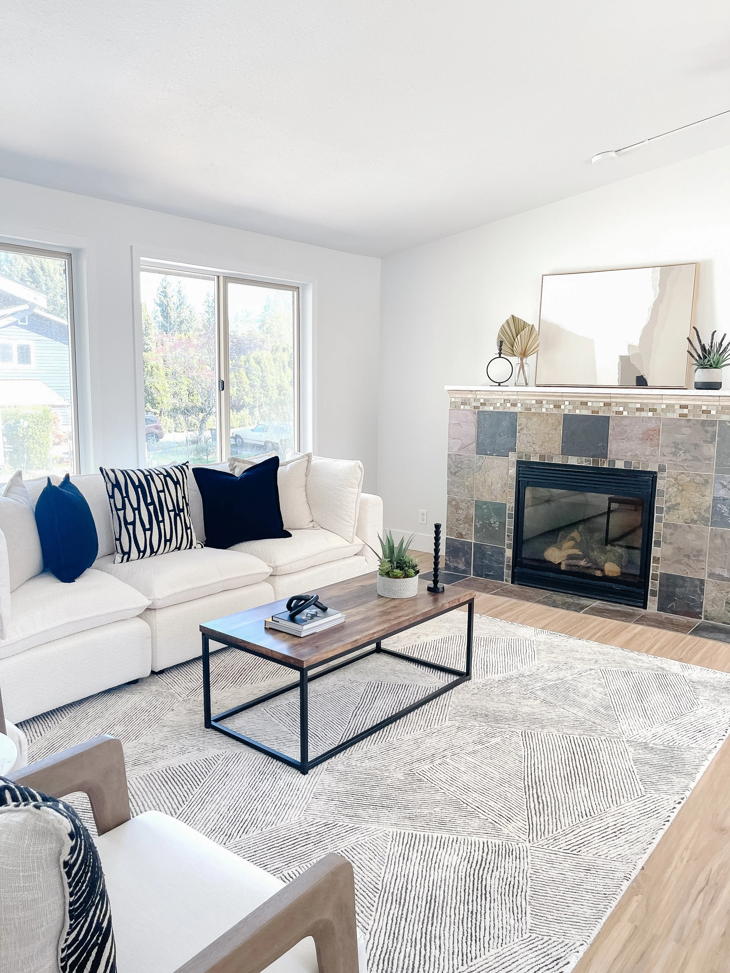 Family room staged in a Snohomish acreage property using warm decor and right-sized furniture.