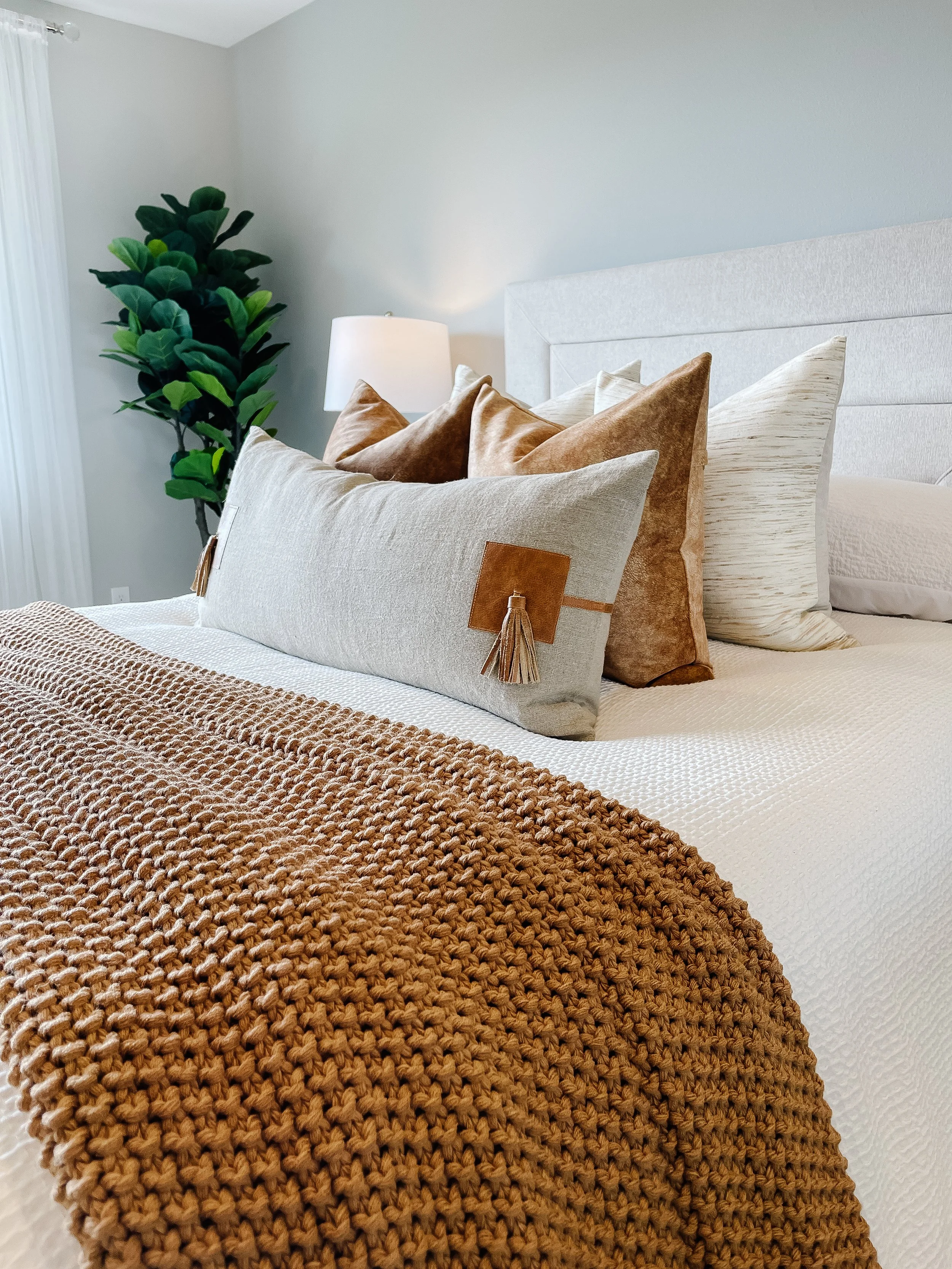 Primary bedroom in La Conner staged with soft textures for a calming feel.