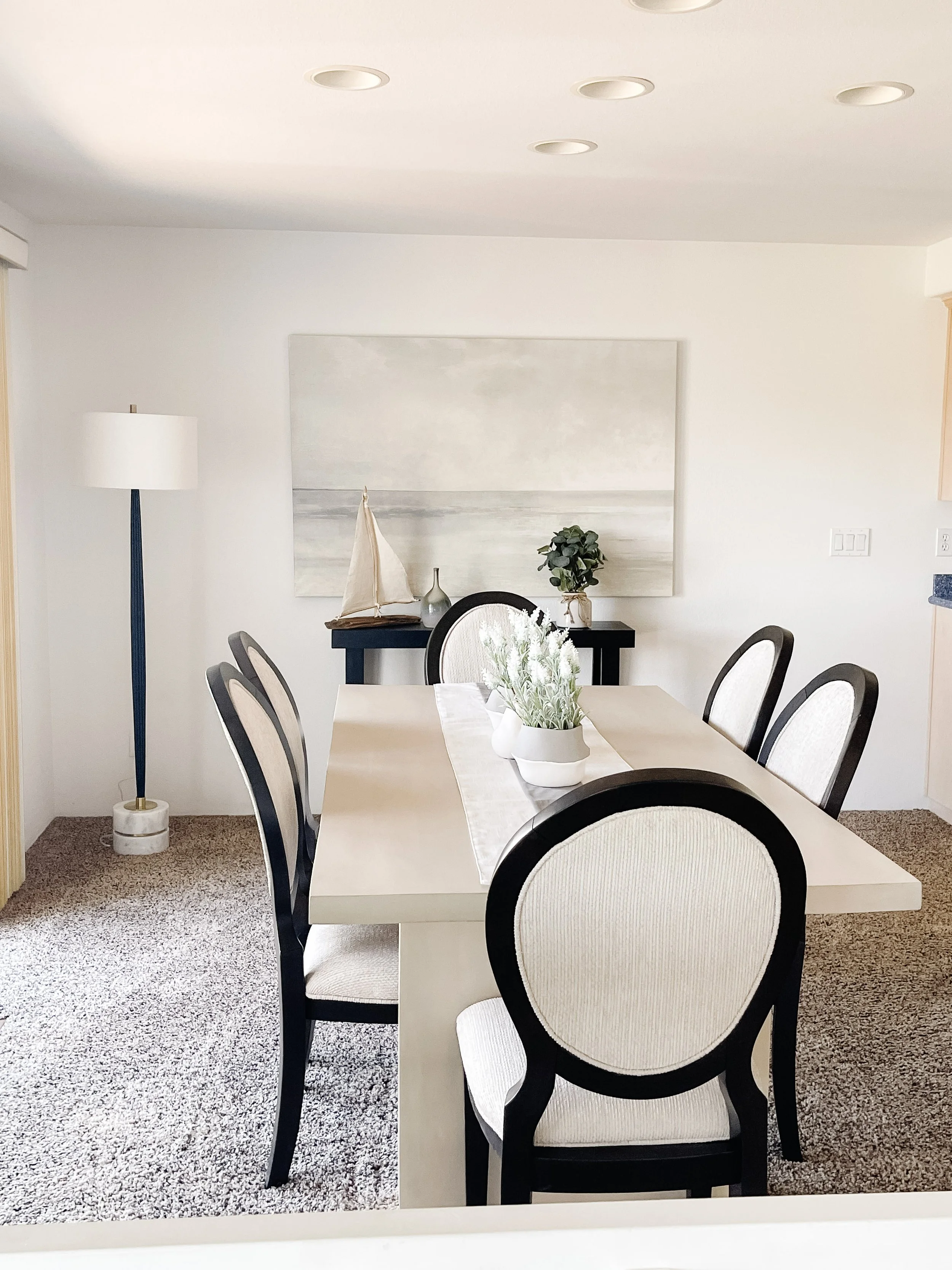 Staged dining room in Mount Vernon designed to showcase natural light and entertaining space.